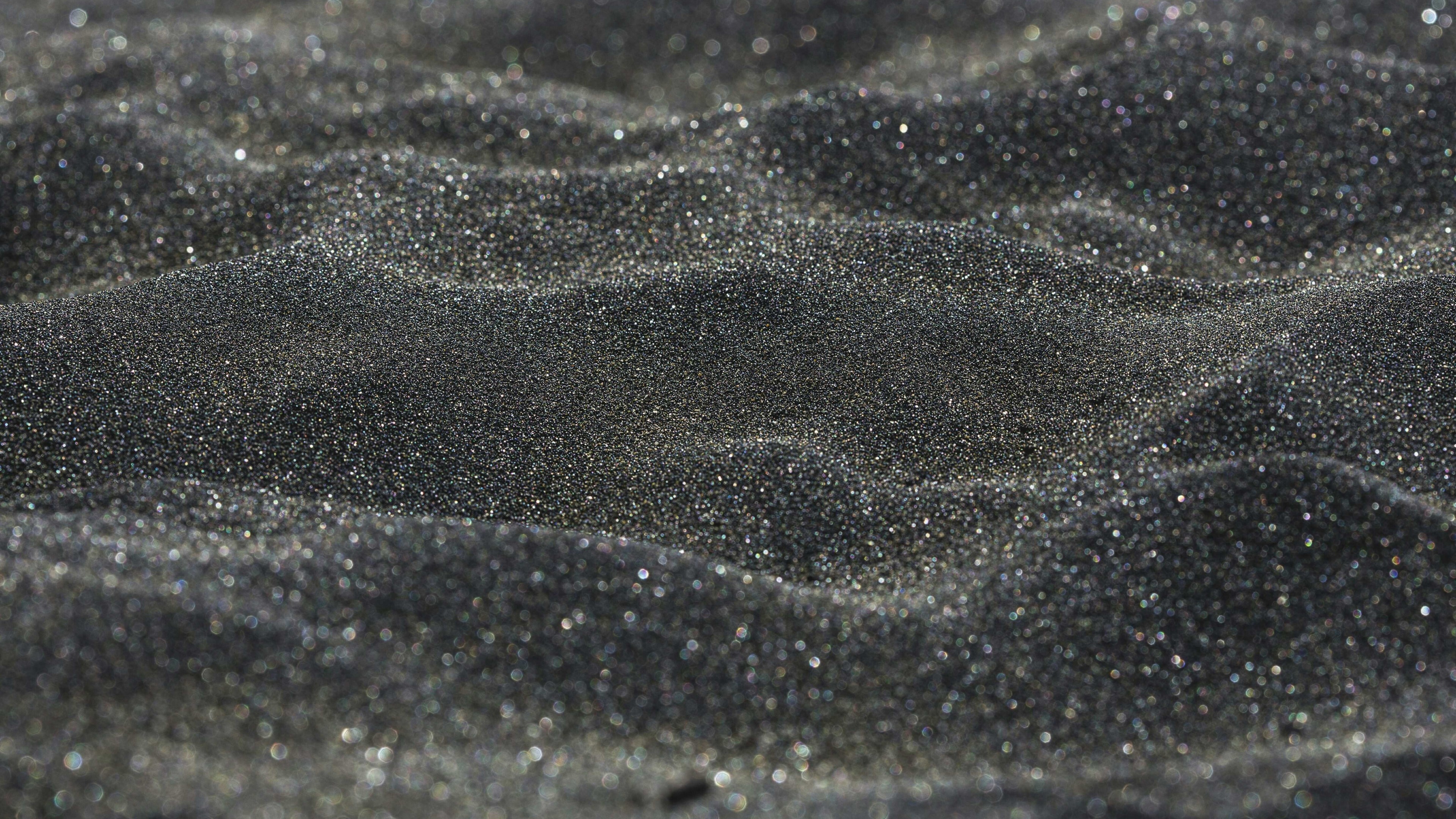 Close-up of Black Glittering Sand HD Wallpaper