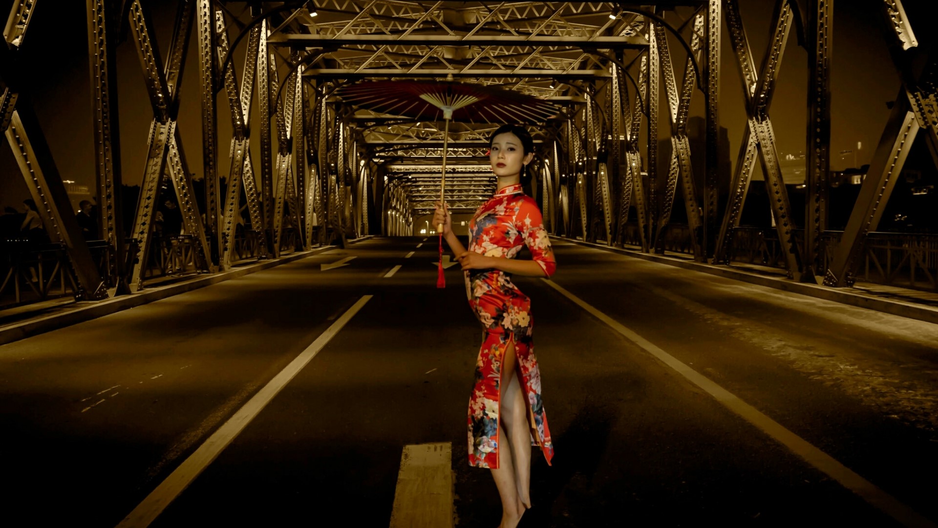 Woman in a red dress holding an umbrella on a bridge HD Wallpaper