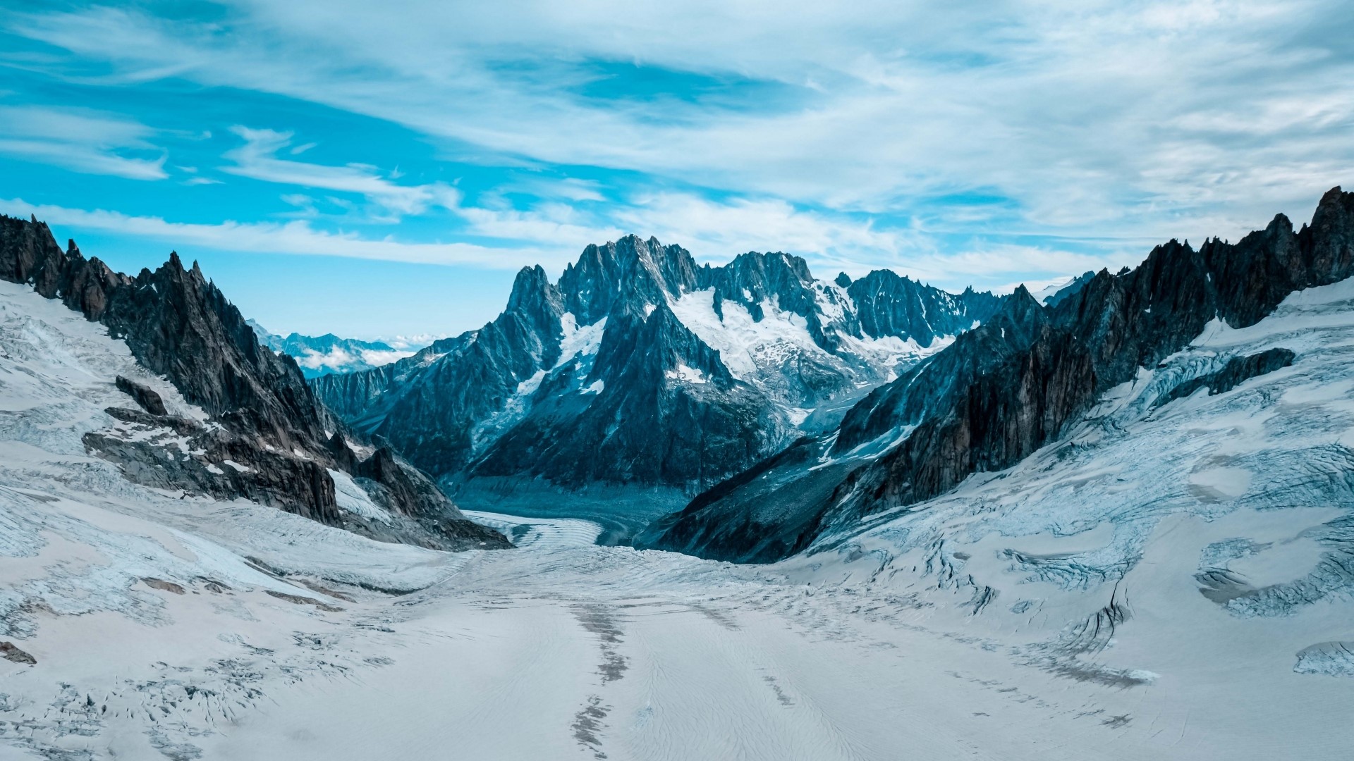 Snowy mountains and glaciers under a blue sky HD Wallpaper