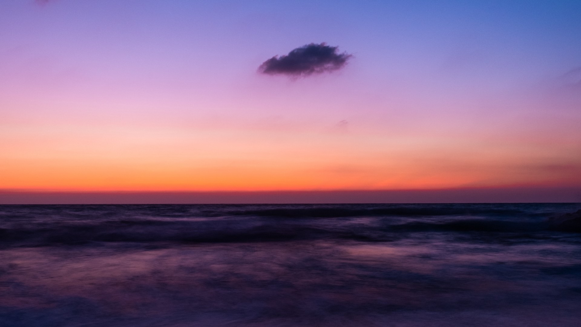 Ocean horizon at sunset with purple and orange sky HD Wallpaper