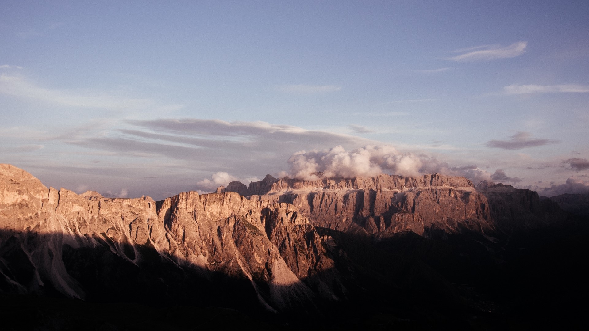 Mountain range at sunset with clouds HD Wallpaper
