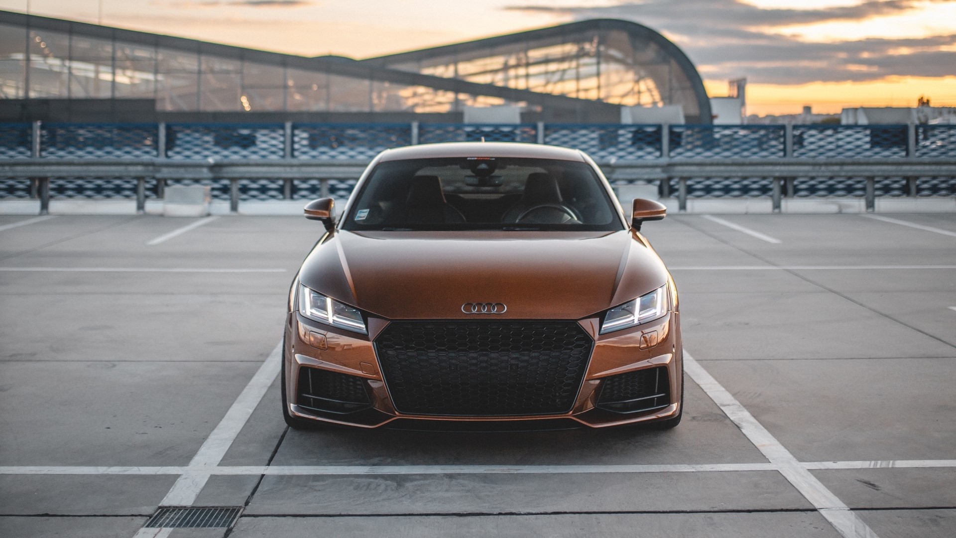 Audi TT parked in a parking lot at sunset HD Wallpaper
