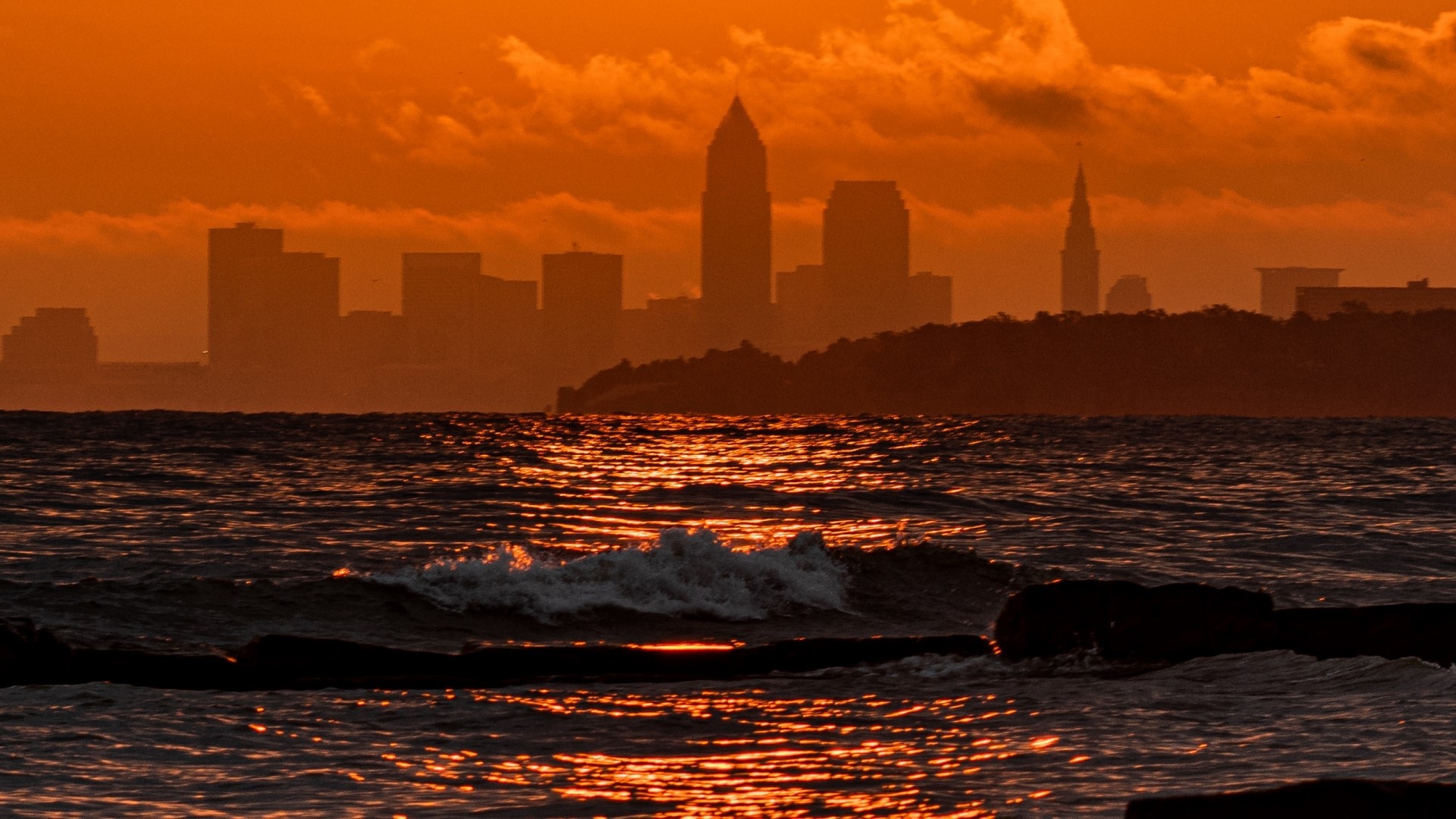 Cleveland skyline at sunset over Lake Erie HD Wallpaper