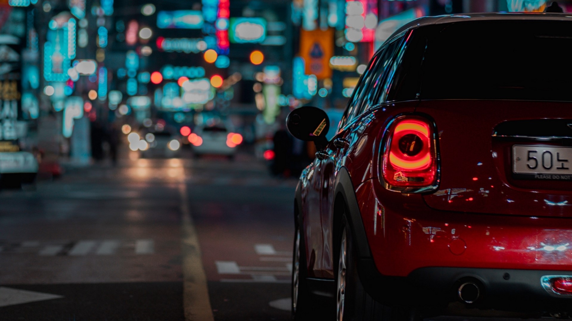 Red Mini Cooper driving at night in city HD Wallpaper