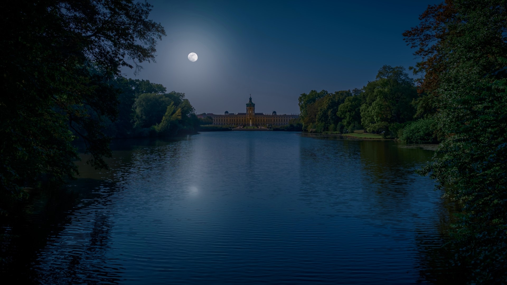 Castle by the lake under the full moon at night HD Wallpaper