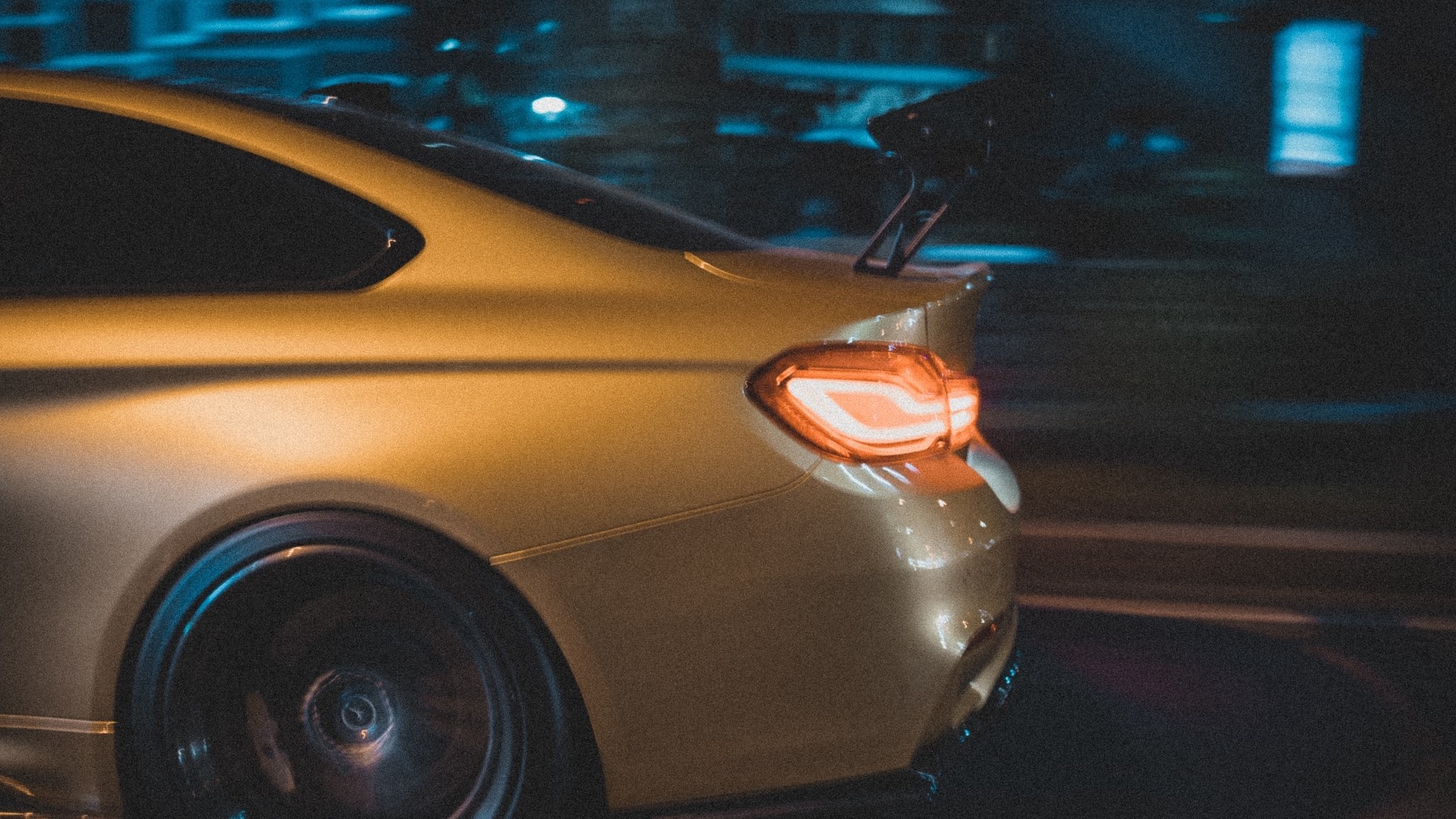 Gold BMW M4 Coupe with Spoiler at Night HD Wallpaper