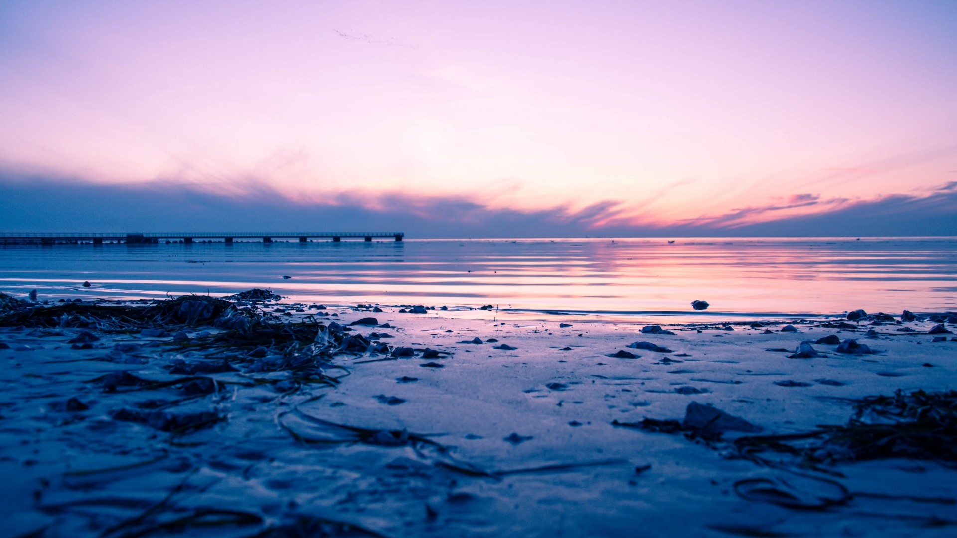 Beach with pier at sunset HD Wallpaper