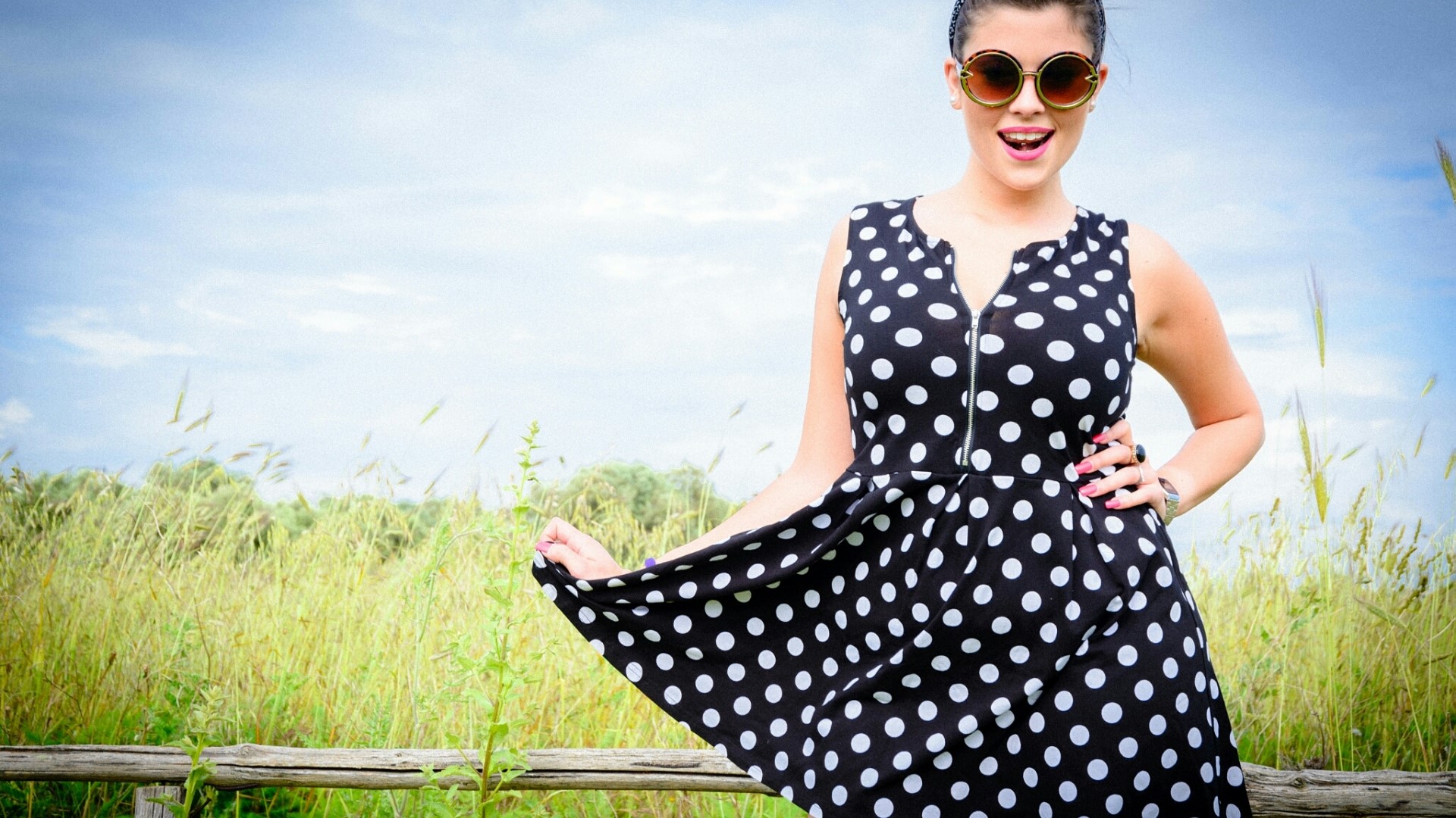 Girl in polka dot dress and sunglasses outdoors HD Wallpaper