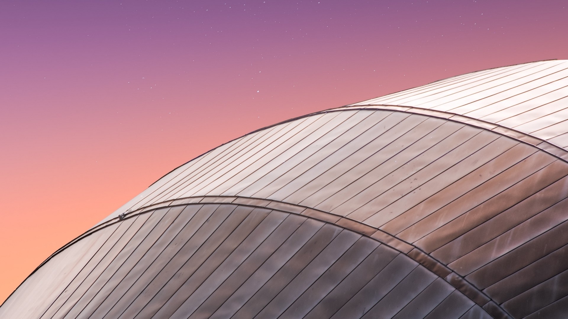 Curved metal roof against a gradient sky HD Wallpaper