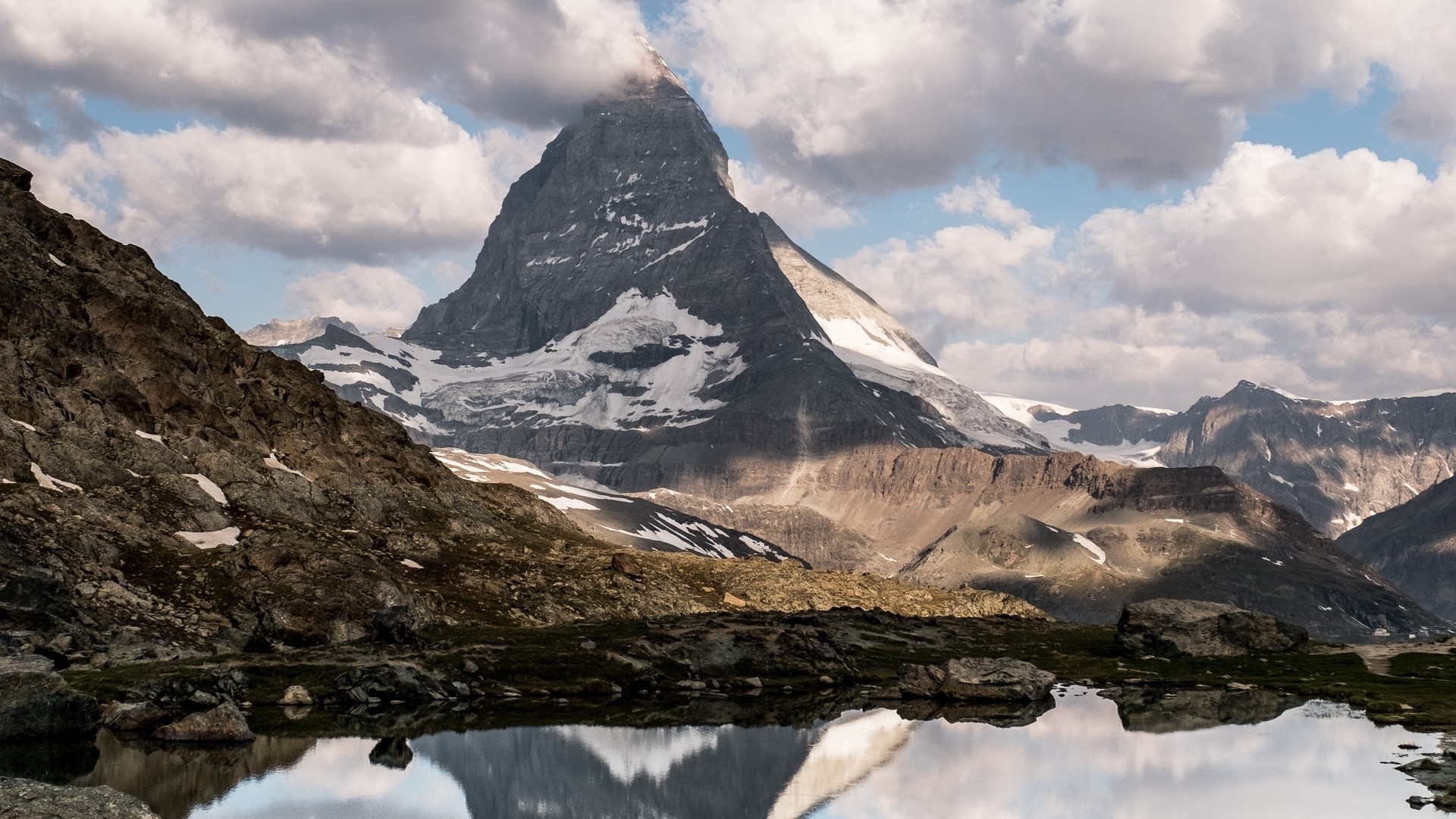 Matterhorn mountain reflected in a lake HD Wallpaper