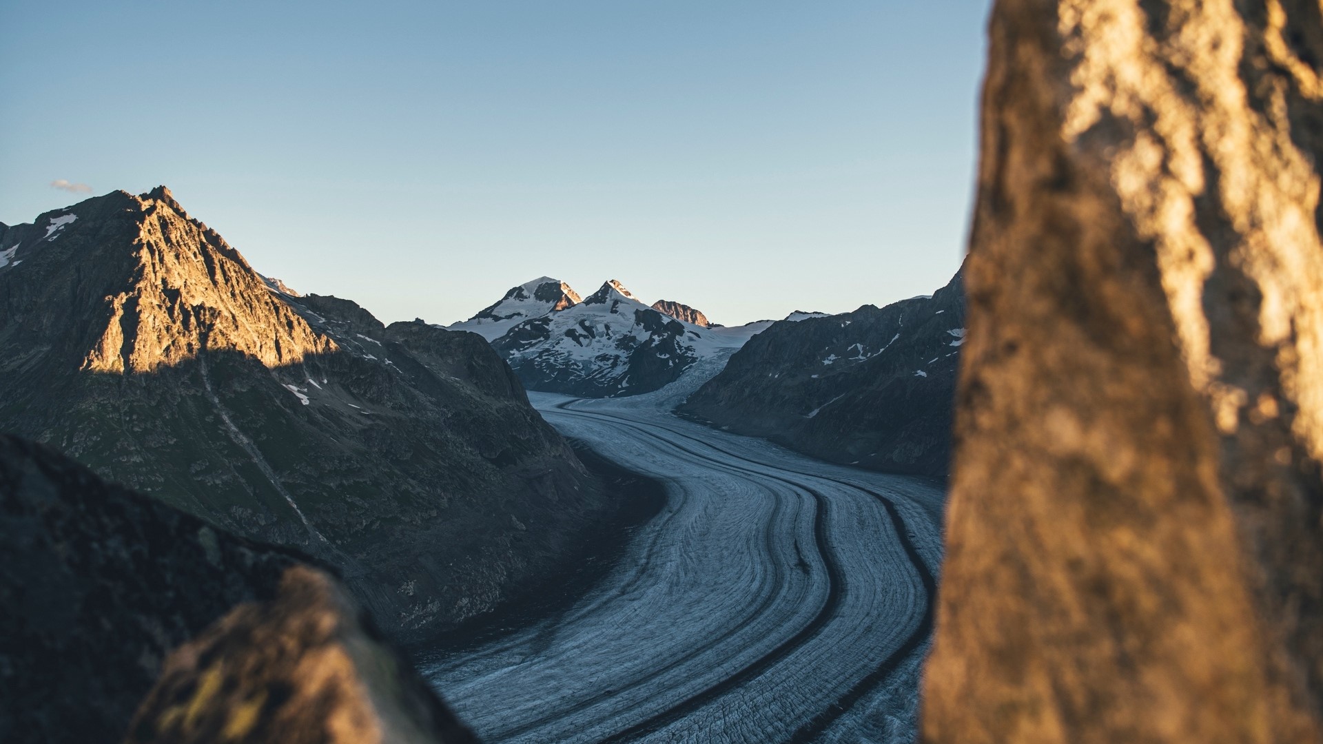 Mountain range with glacier and rock foreground HD Wallpaper