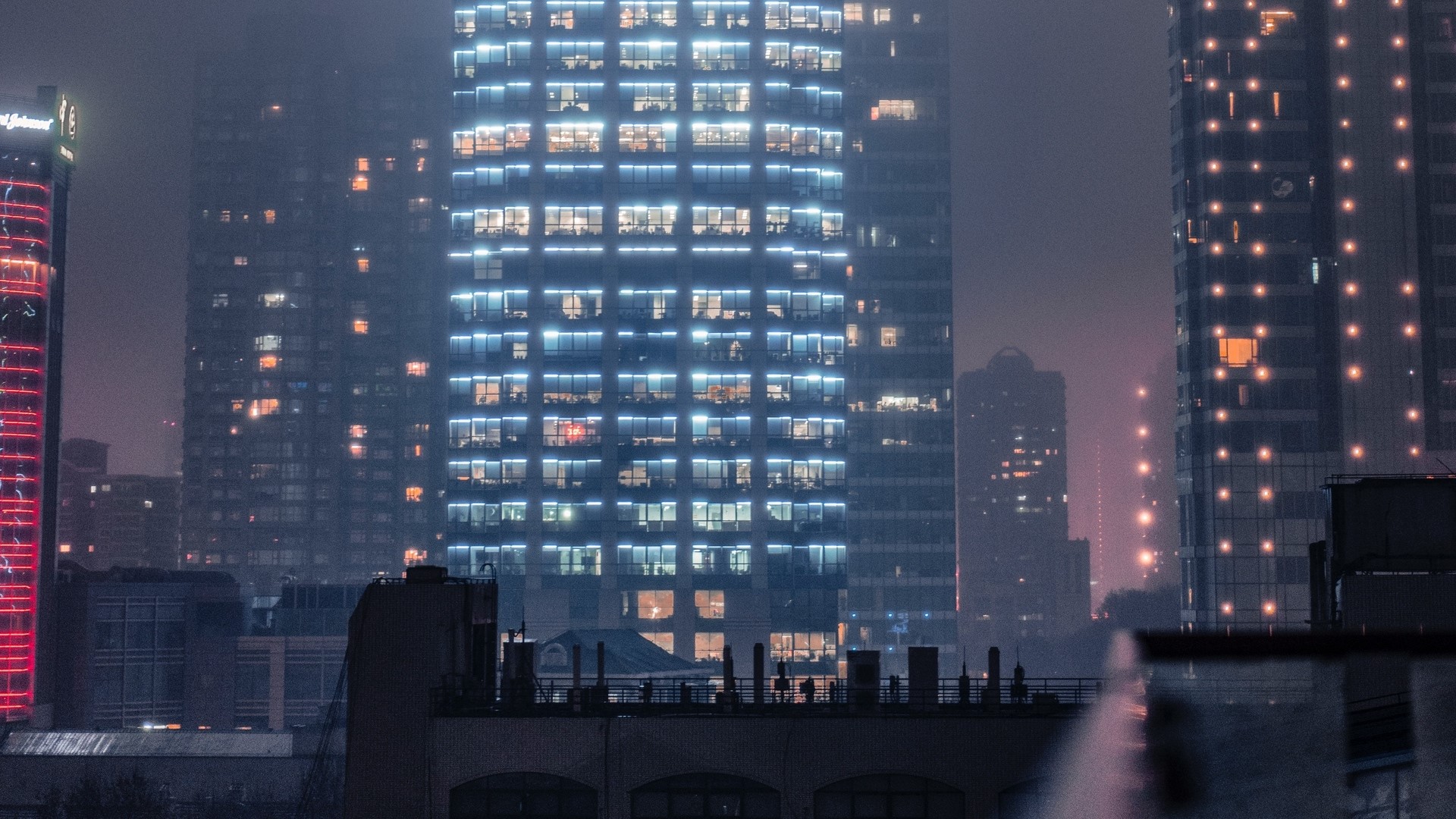Night city skyline with illuminated skyscrapers HD Wallpaper