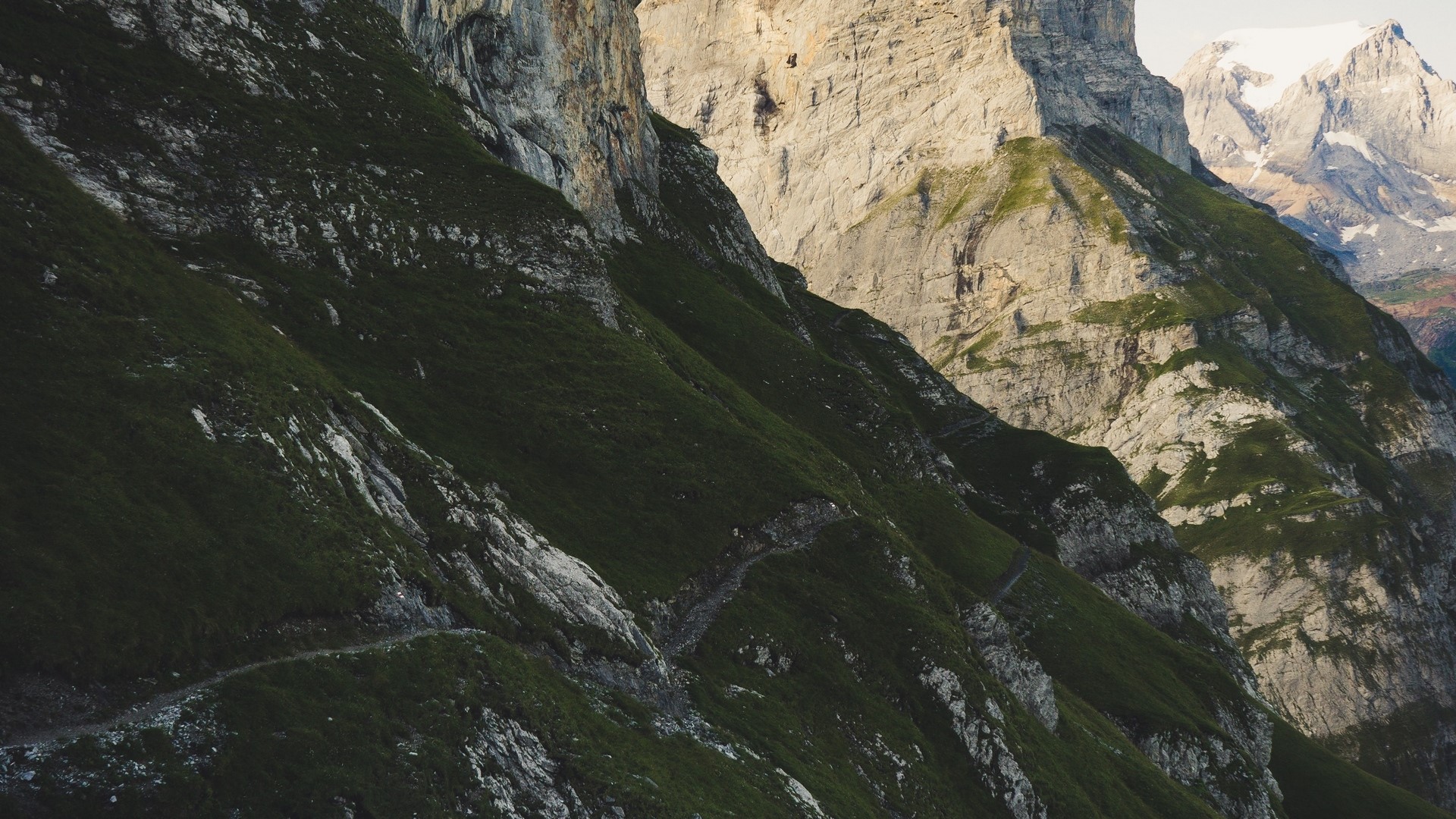 Mountain slope with a winding path HD Wallpaper