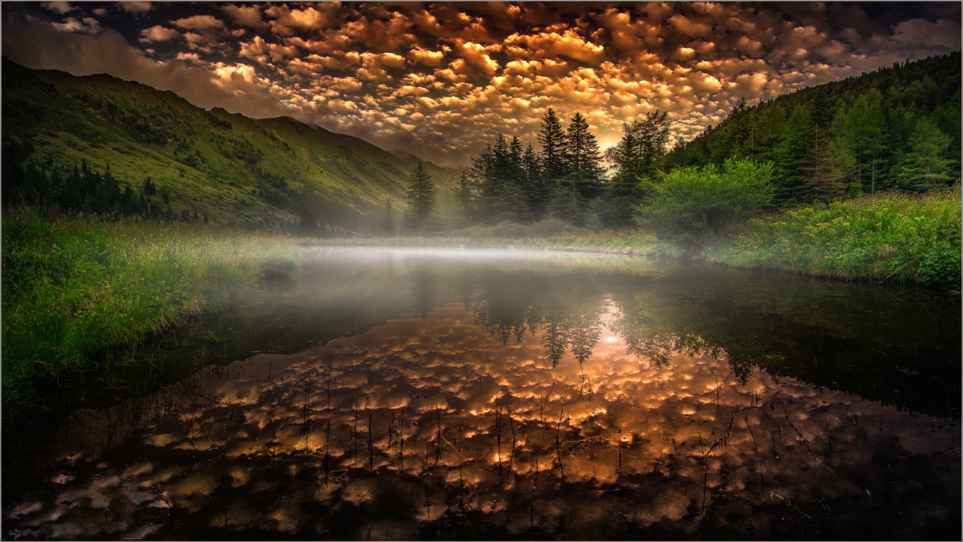 Mountain lake with reflection of clouds at sunset HD Wallpaper