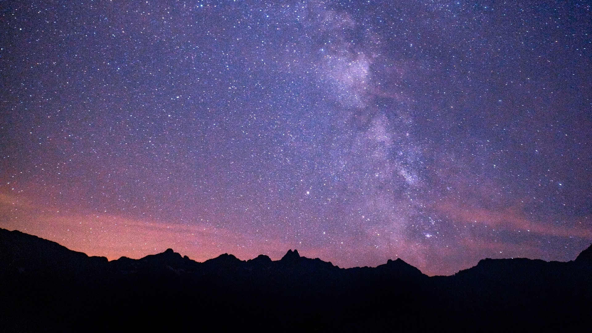 Starry night sky over mountains HD Wallpaper