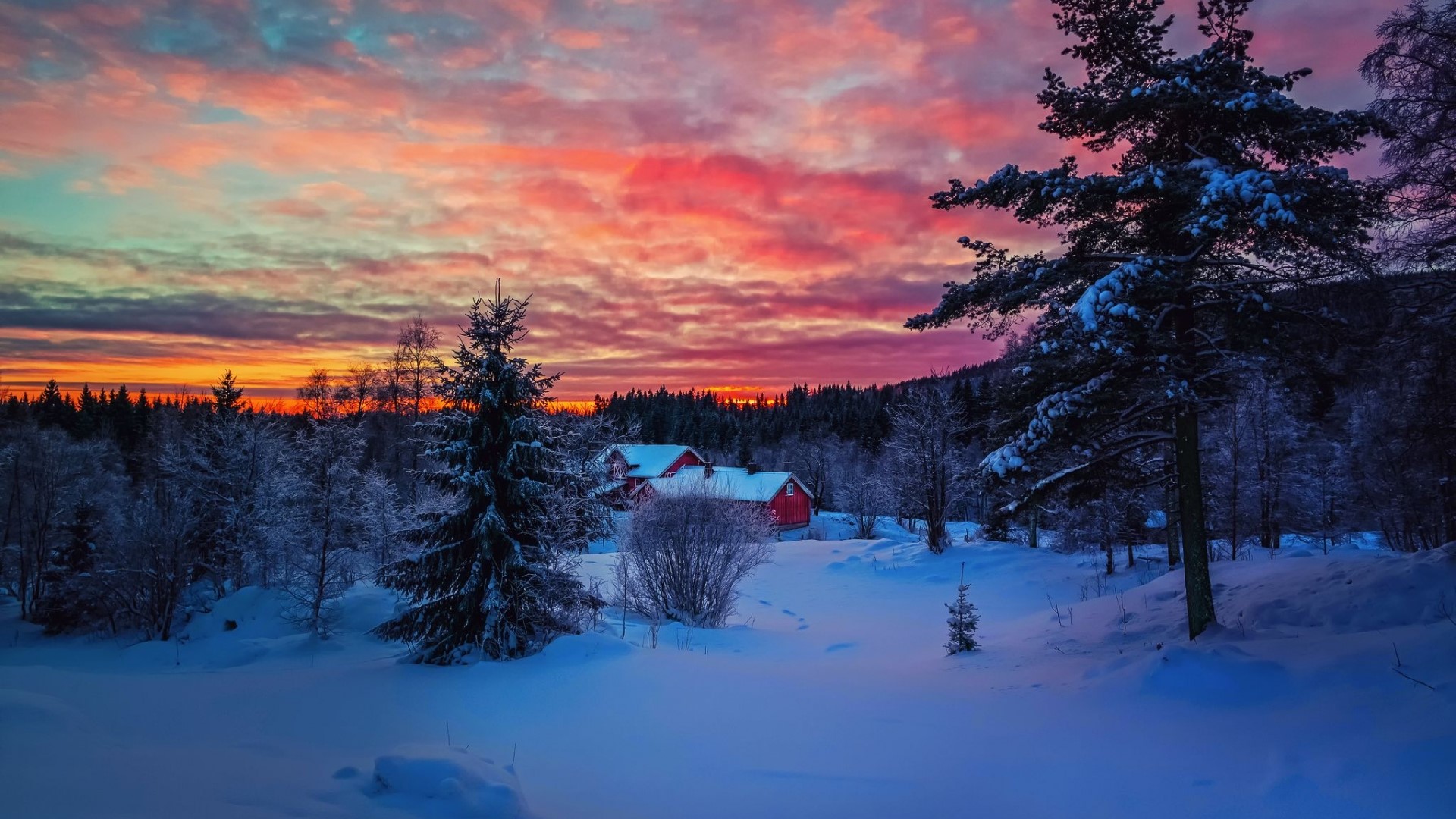 Winter Sunset Over Snowy Landscape with Red Houses HD Wallpaper