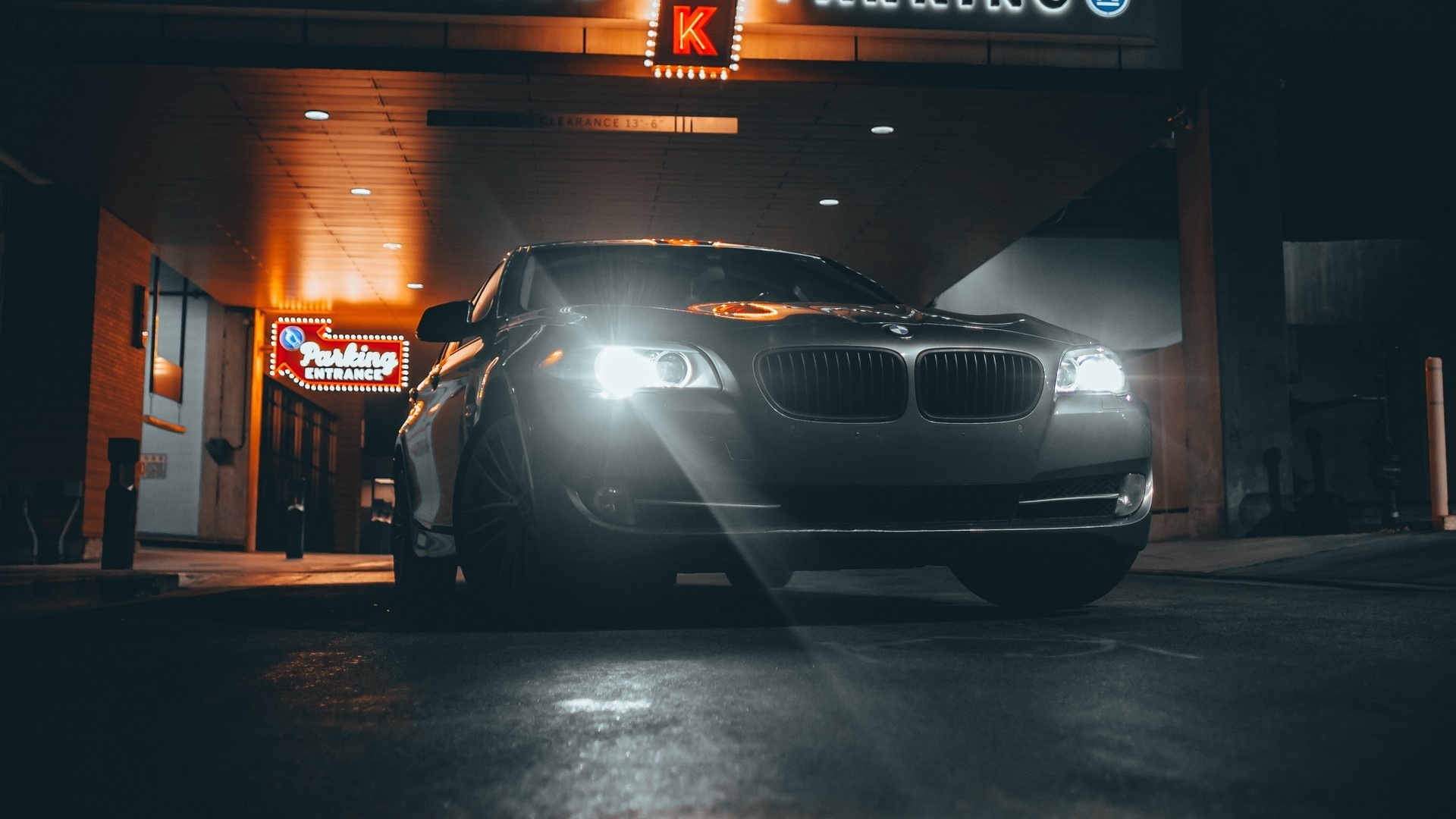 BMW car at parking entrance at night HD Wallpaper