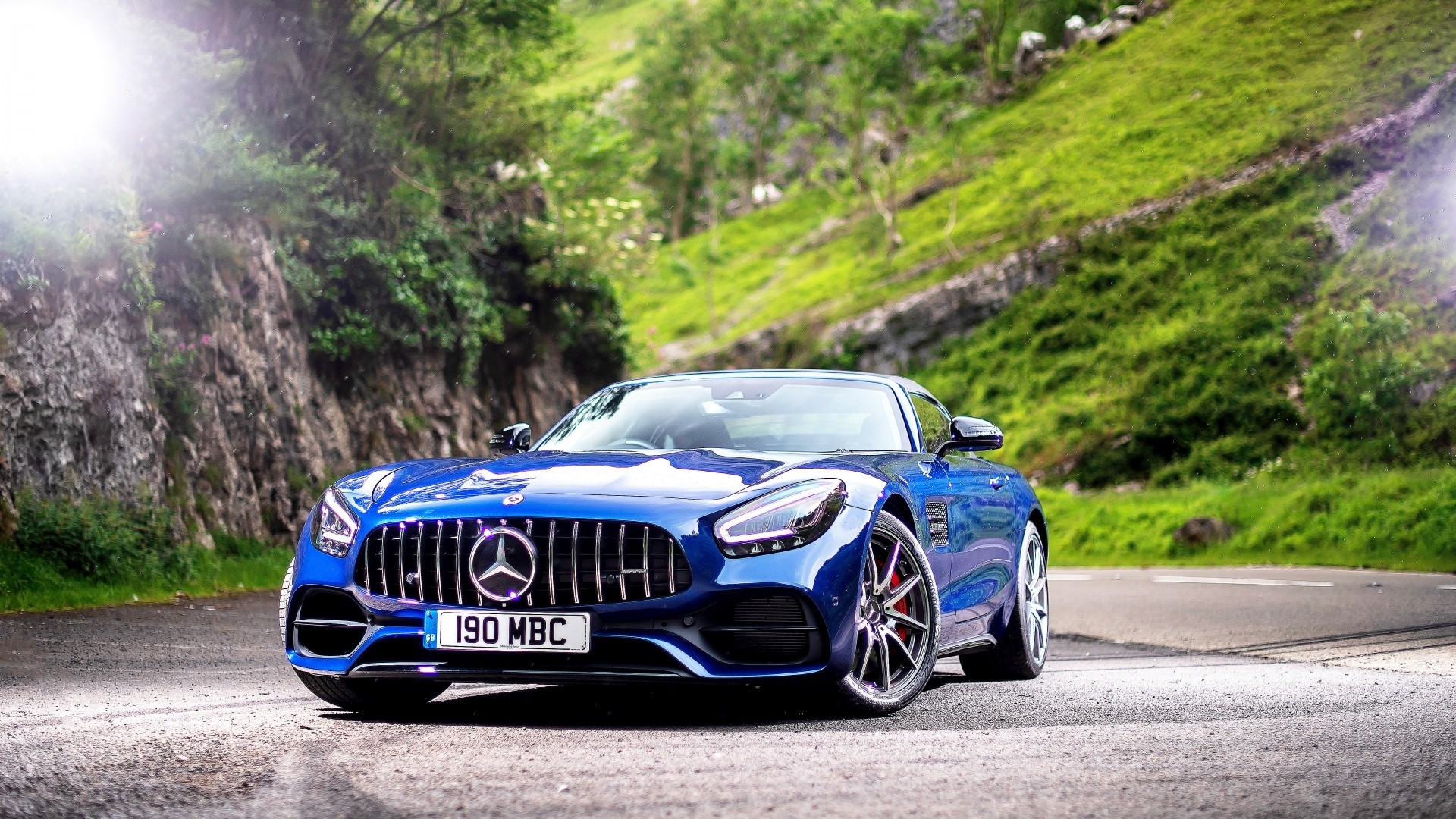 Blue Mercedes-AMG GT 2019 on a road HD Wallpaper