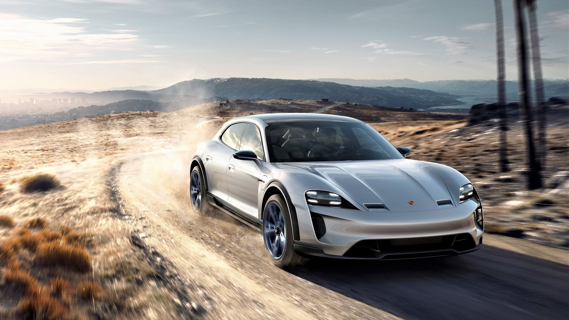 Porsche Mission E Cross Turismo driving on dirt road HD Wallpaper