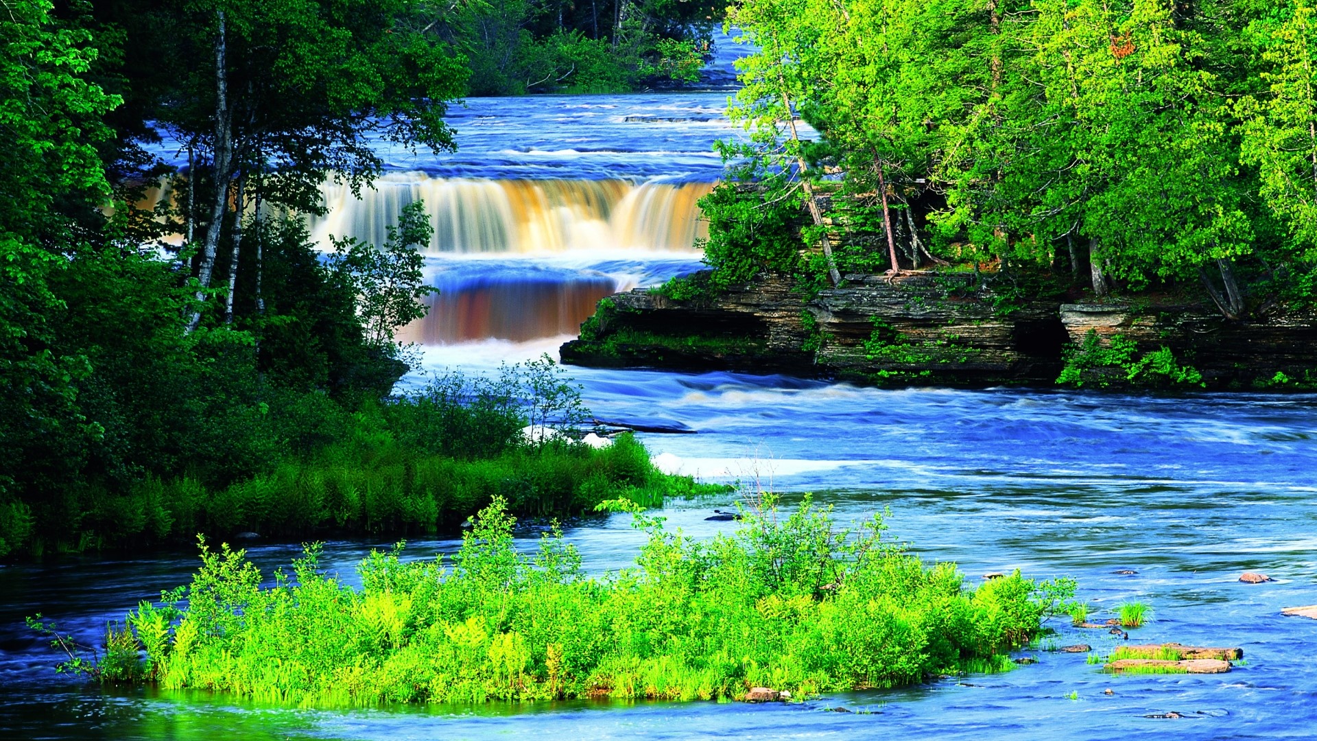 Blue waterfall surrounded by green trees HD Wallpaper