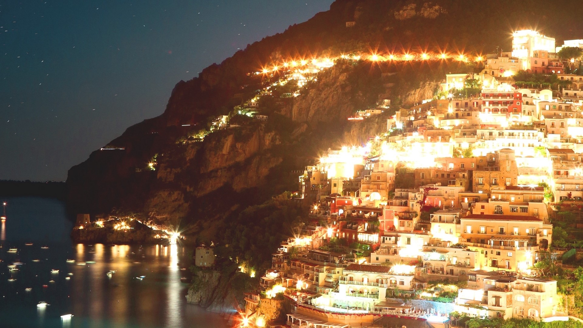 Positano cliffside village at night HD Wallpaper