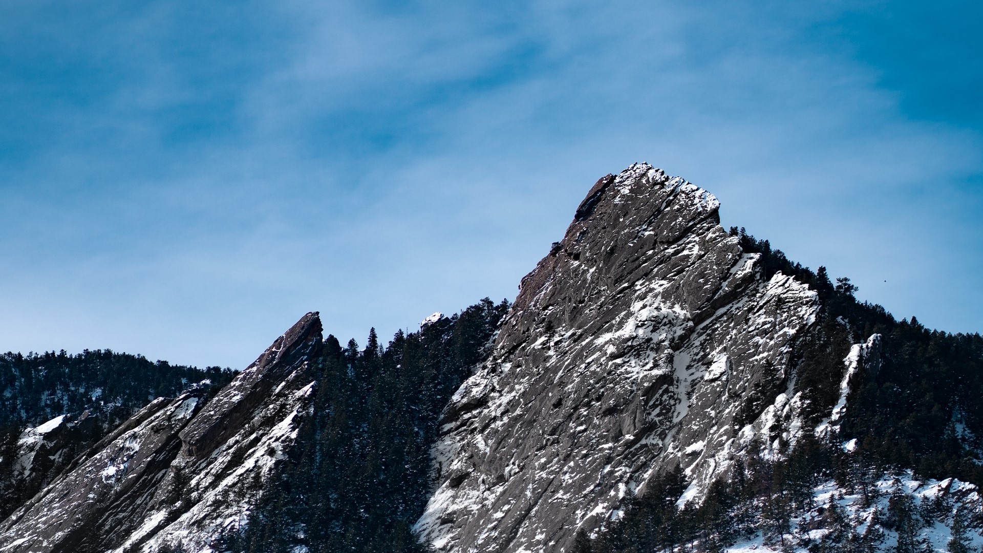Snow-covered mountains under a blue sky HD Wallpaper