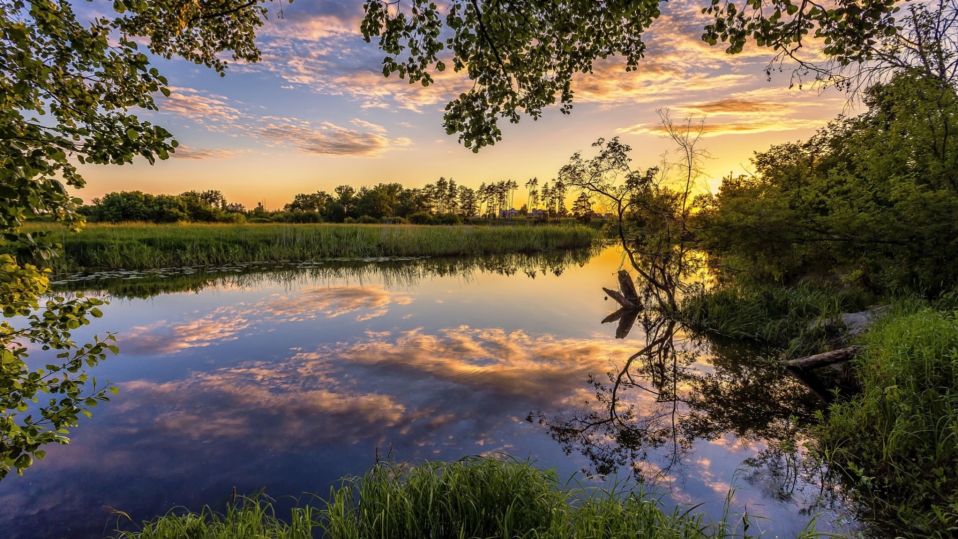 Sunset over a calm river with reflections HD Wallpaper