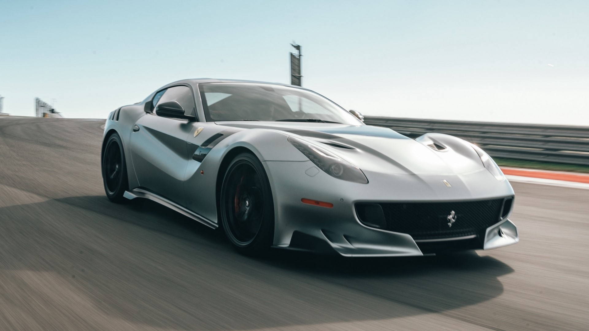 Ferrari F12 Berlinetta on a Racetrack HD Wallpaper