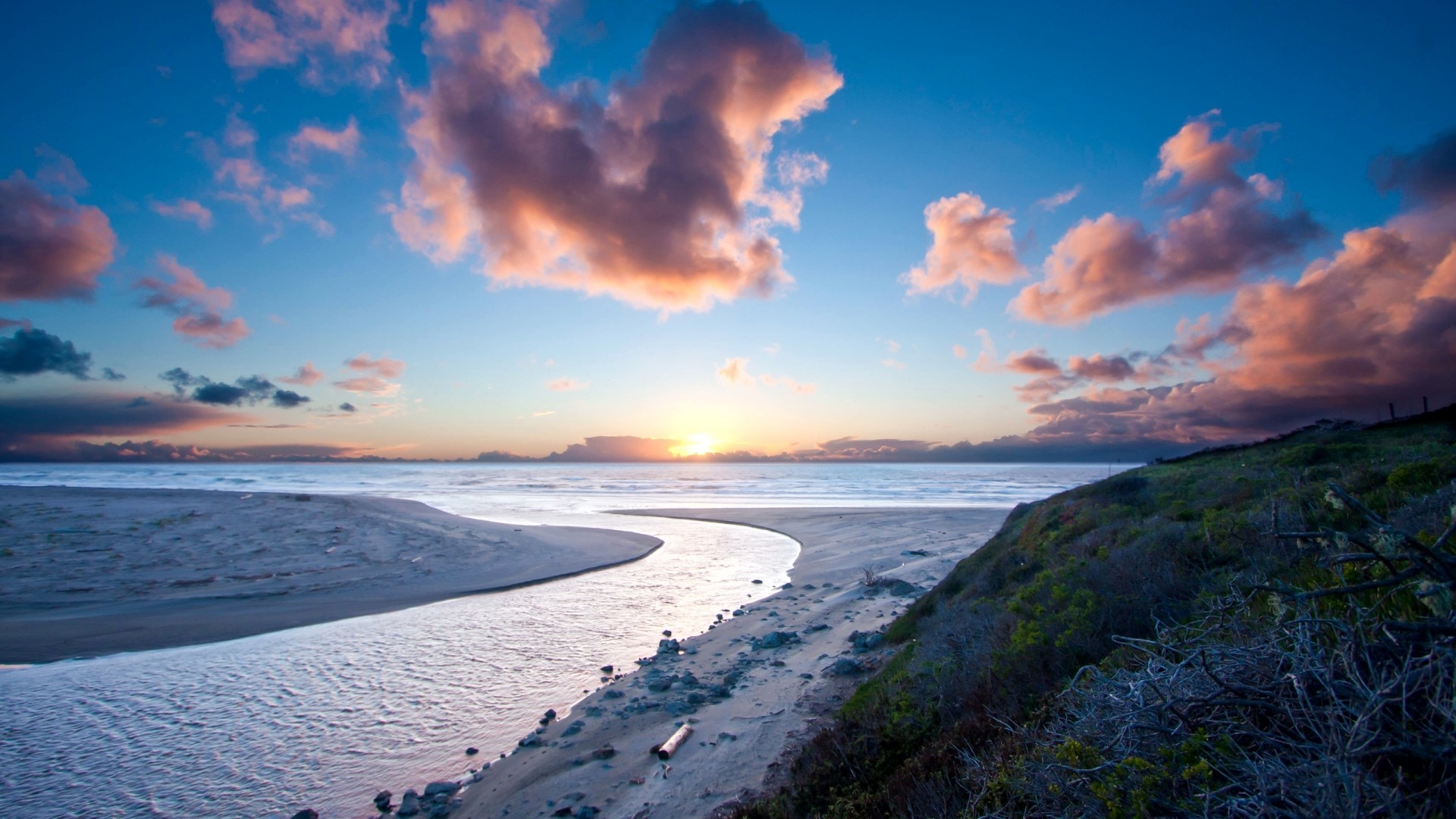 Sunset over a winding river and ocean HD Wallpaper