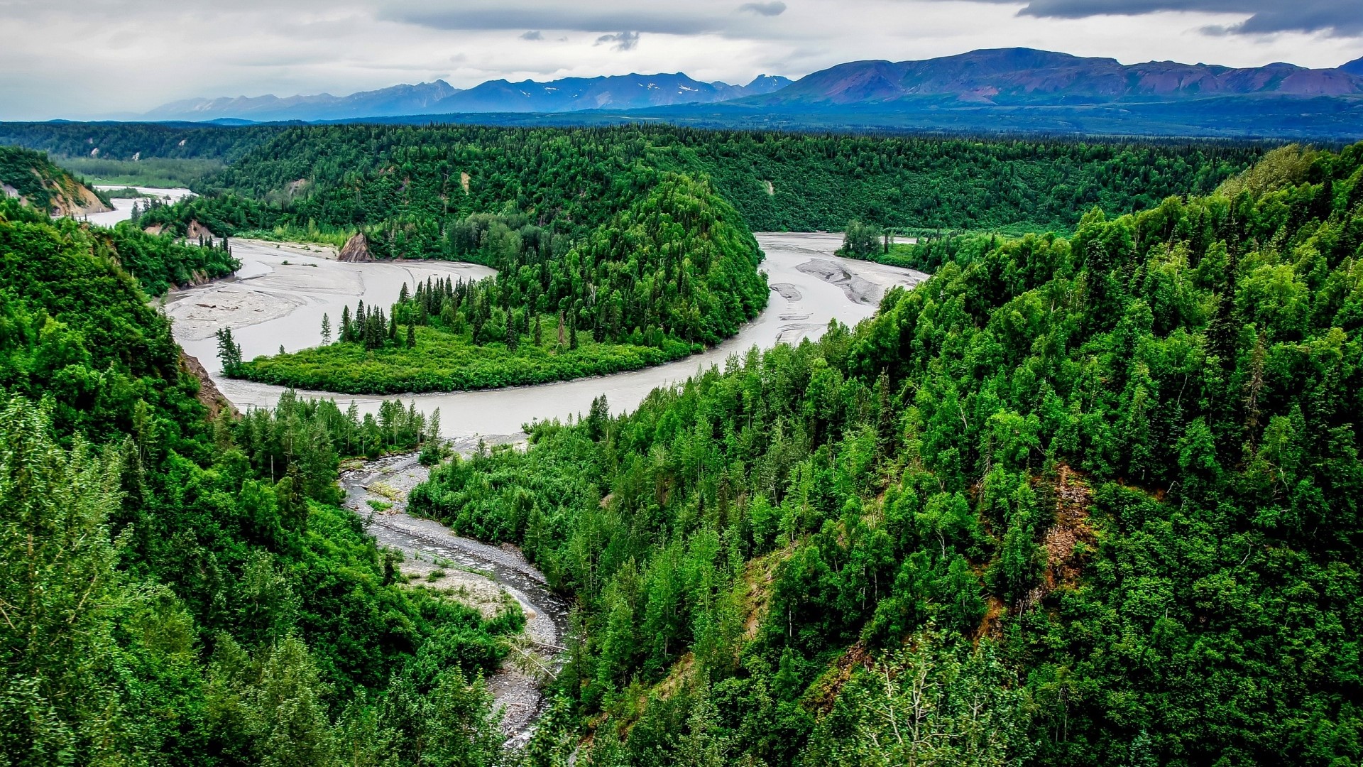 River winding through forested valley in Alaska HD Wallpaper
