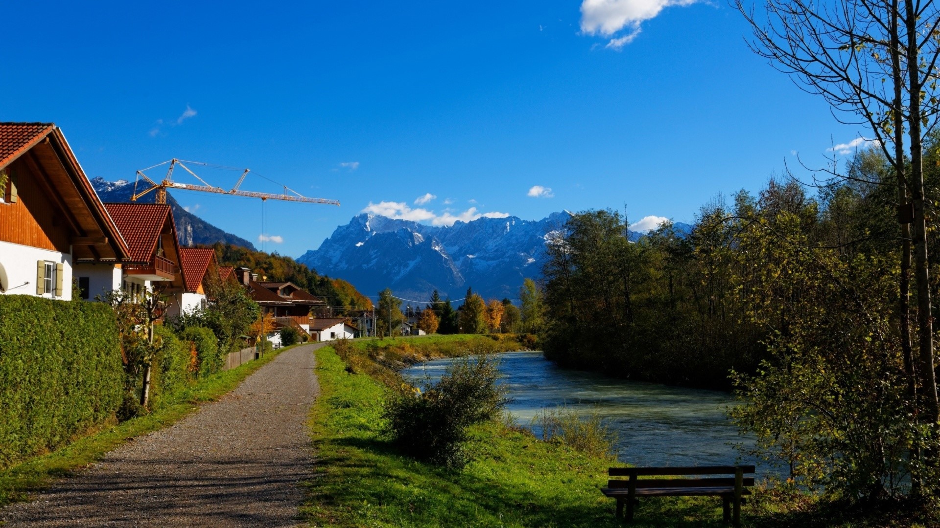 Houses and river in Oberau, Germany with mountains HD Wallpaper