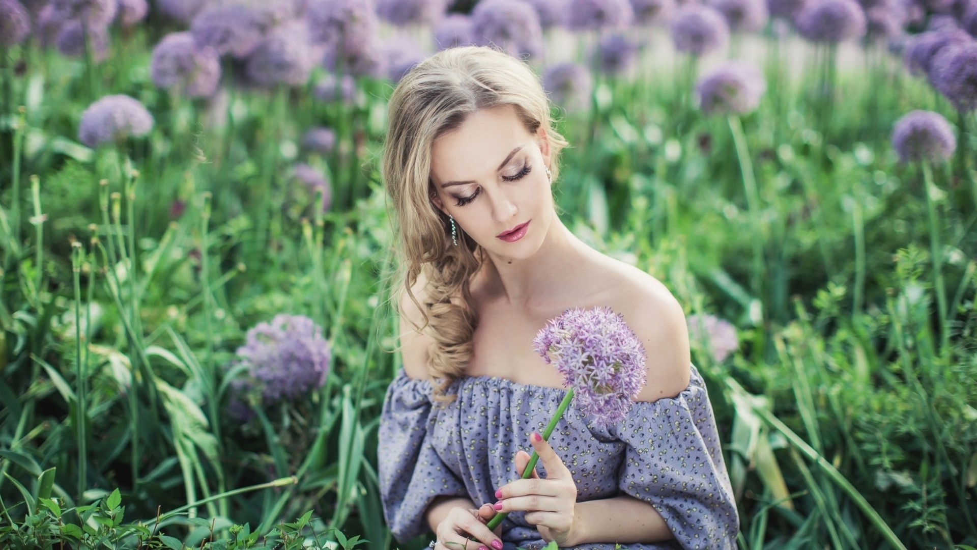 Blonde woman in a field of purple flowers HD Wallpaper