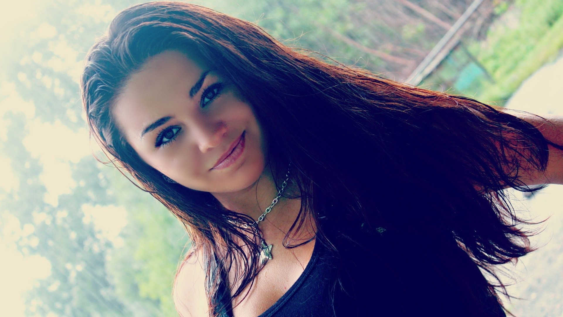 Woman with long dark hair and necklace HD Wallpaper