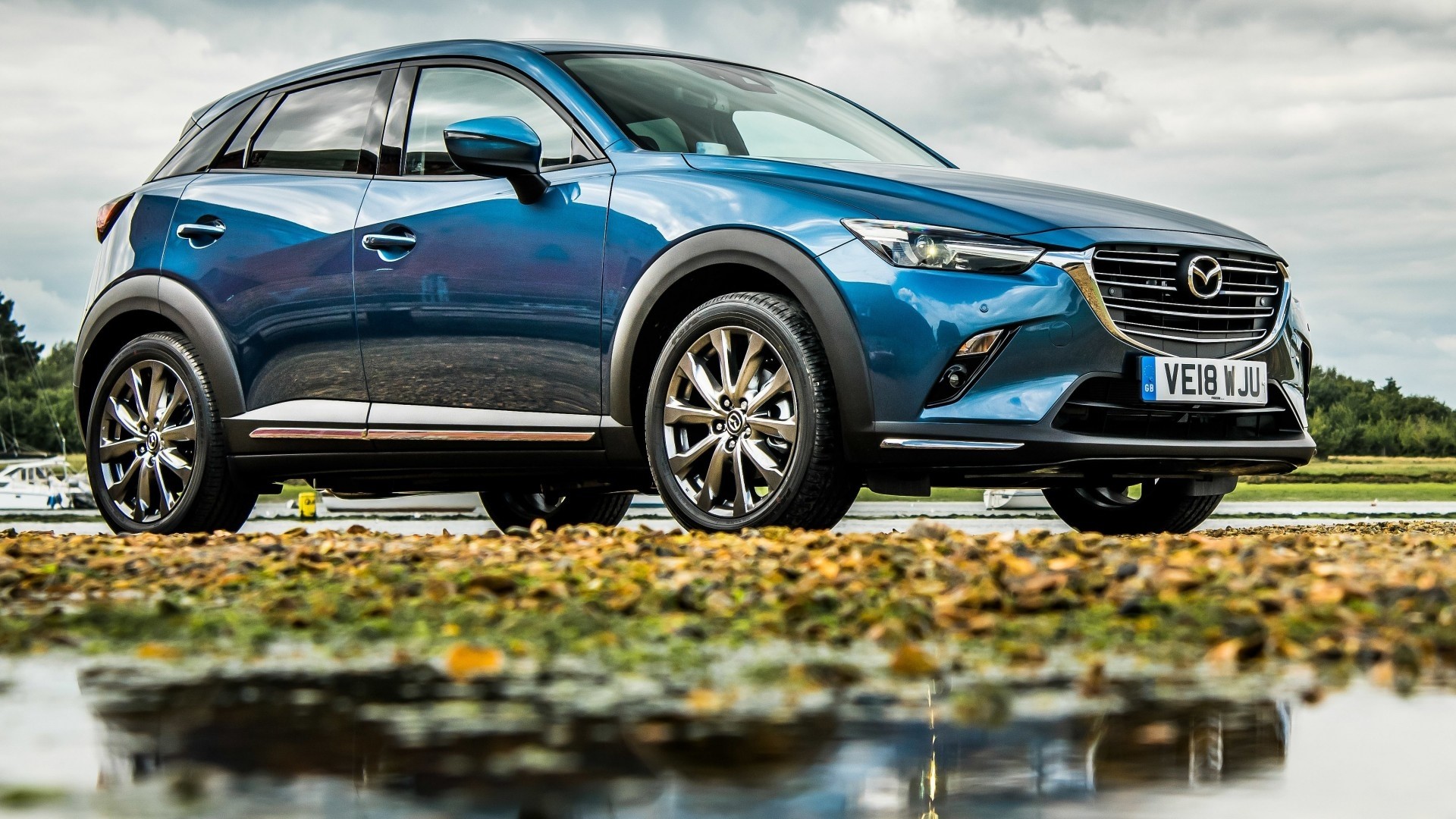 Blue Mazda CX-3 parked outdoors HD Wallpaper