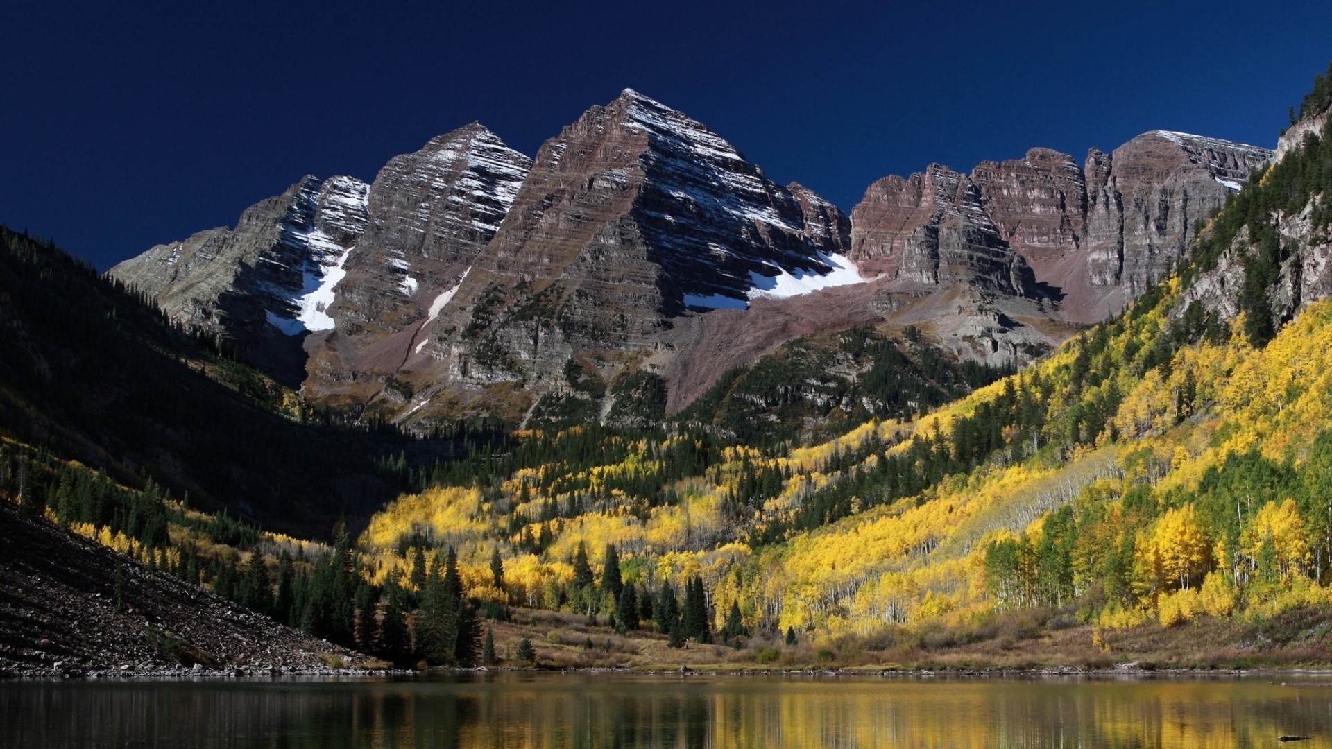 Maroon Bells mountains reflected in lake during autumn HD Wallpaper