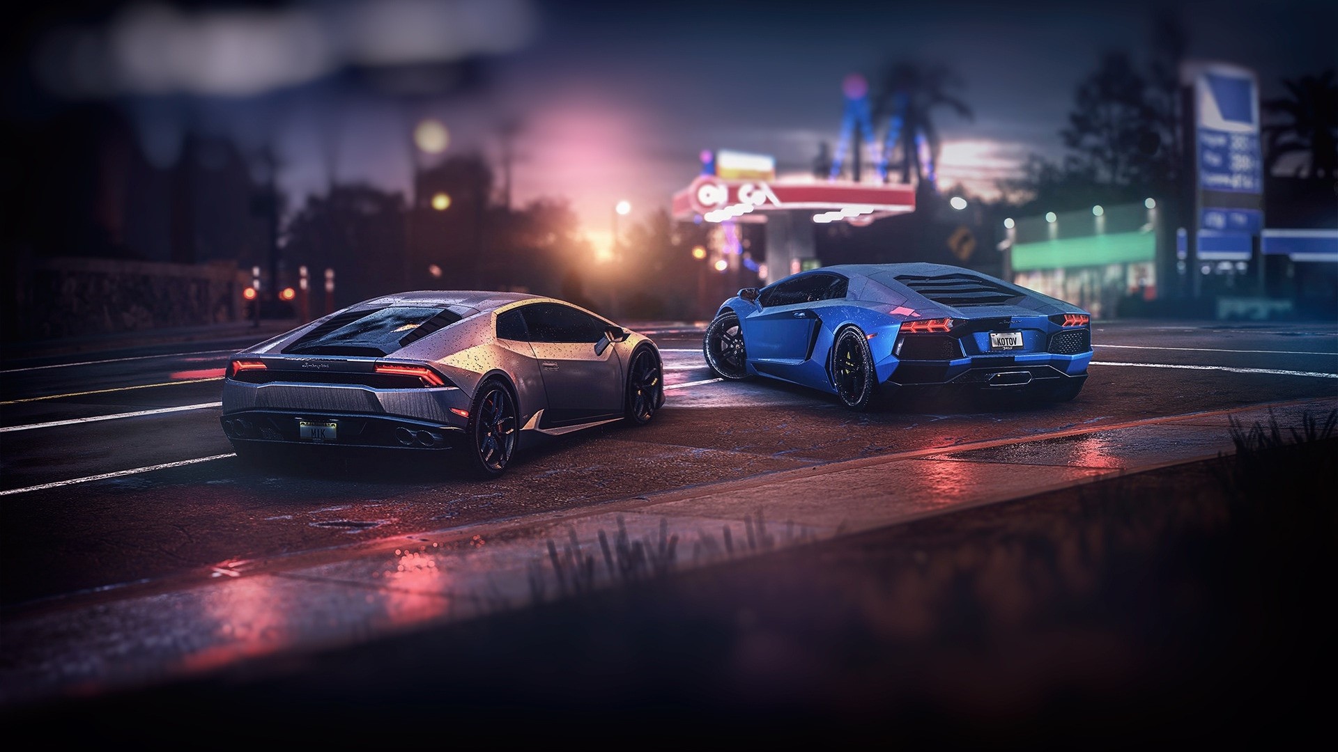 Two Lamborghinis on a wet street at night HD Wallpaper