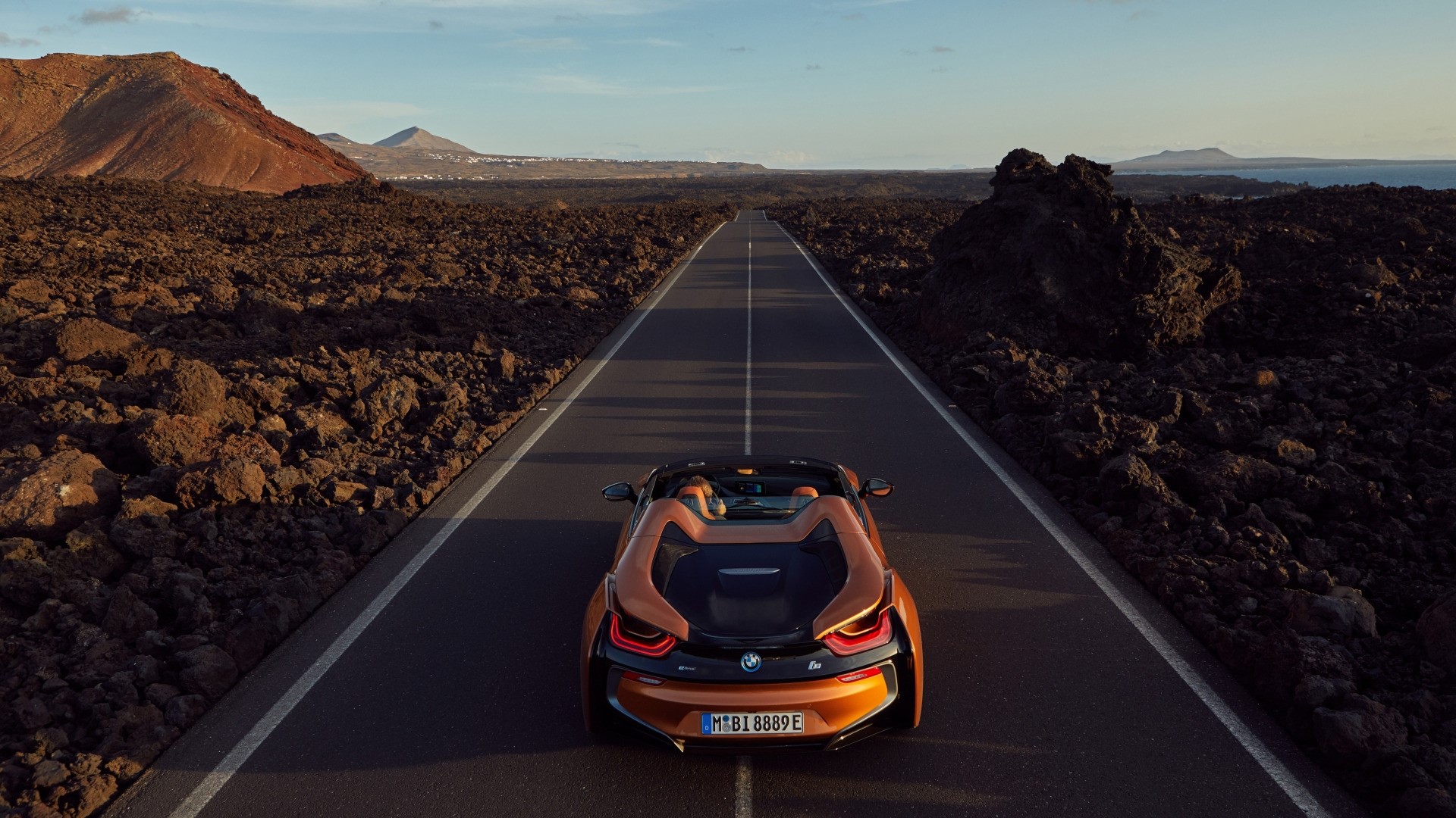 BMW I8 Convertible on a Road in a Volcanic Landscape HD Wallpaper