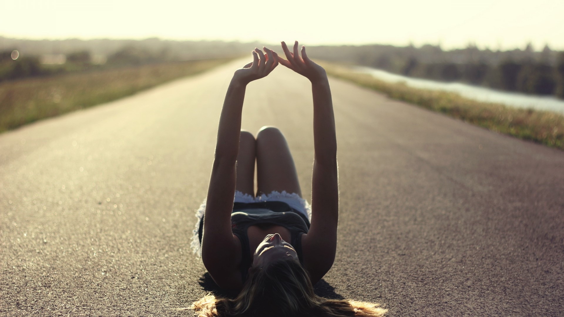 Girl lying on a road HD Wallpaper
