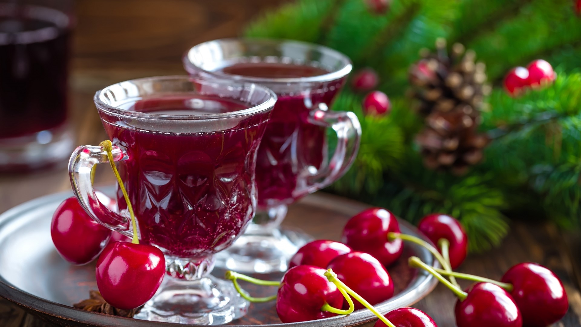 Cherry drink with cherries and pine branches HD Wallpaper