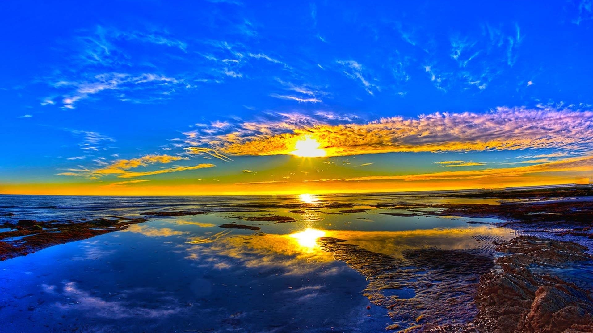Sunset over the sea with reflections HD Wallpaper