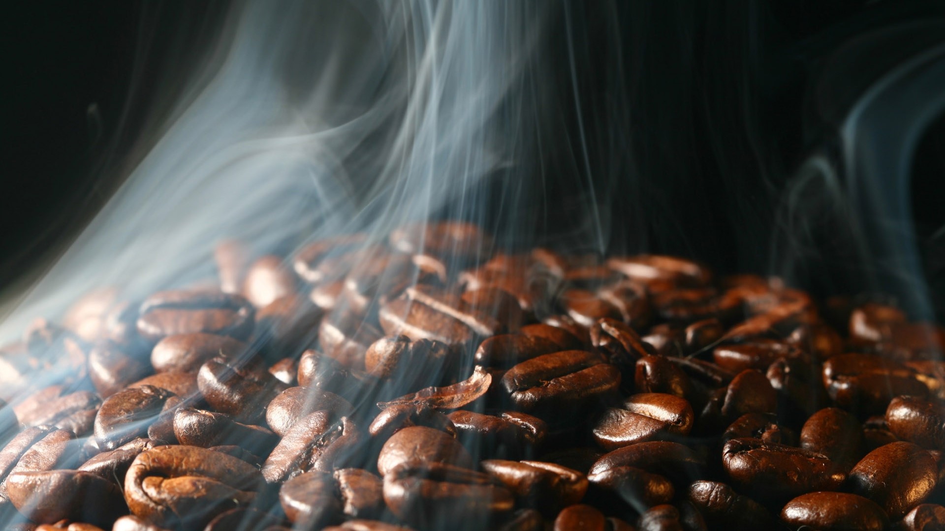Close-up of steaming coffee beans HD Wallpaper