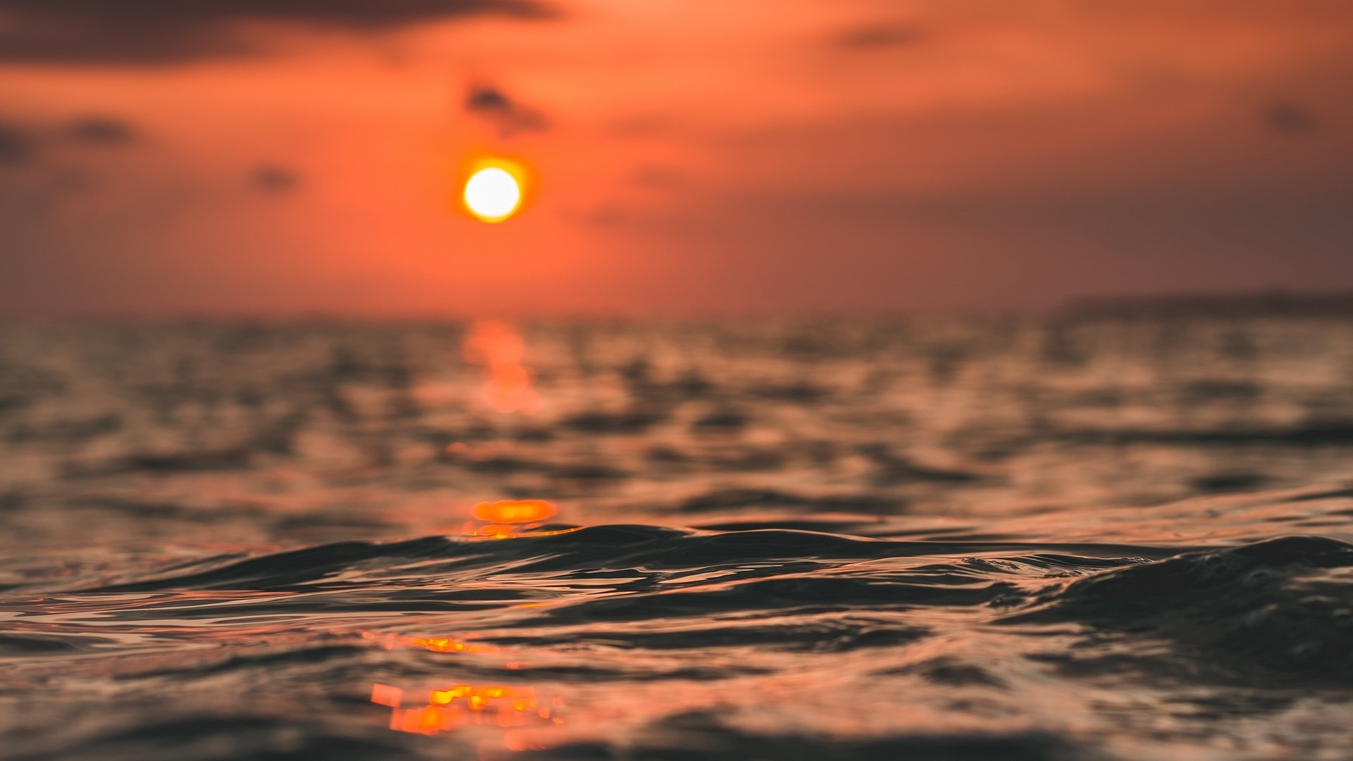Sunset over the ocean with waves HD Wallpaper