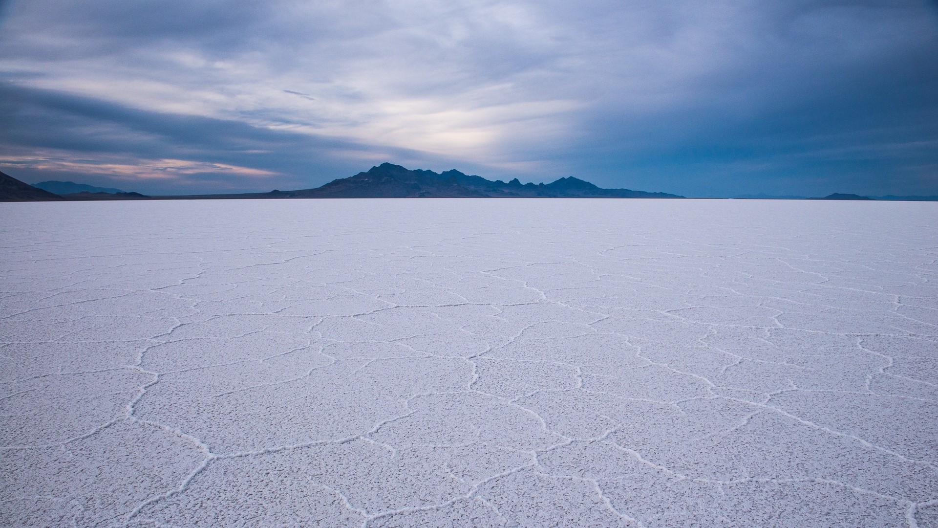 Salt Flats with Mountains Under Cloudy Sky HD Wallpaper