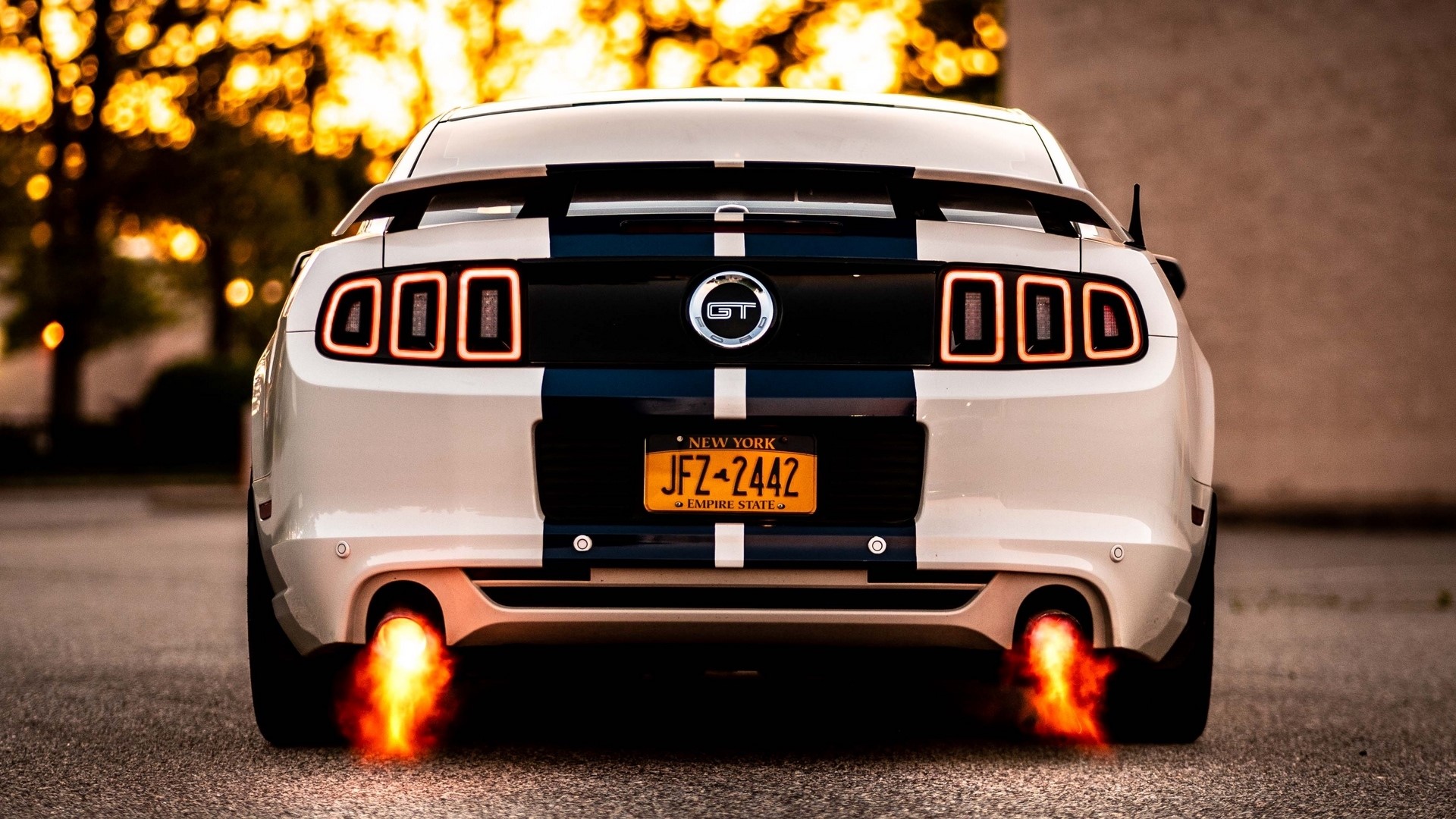 White Ford Mustang GT with flames from exhaust HD Wallpaper