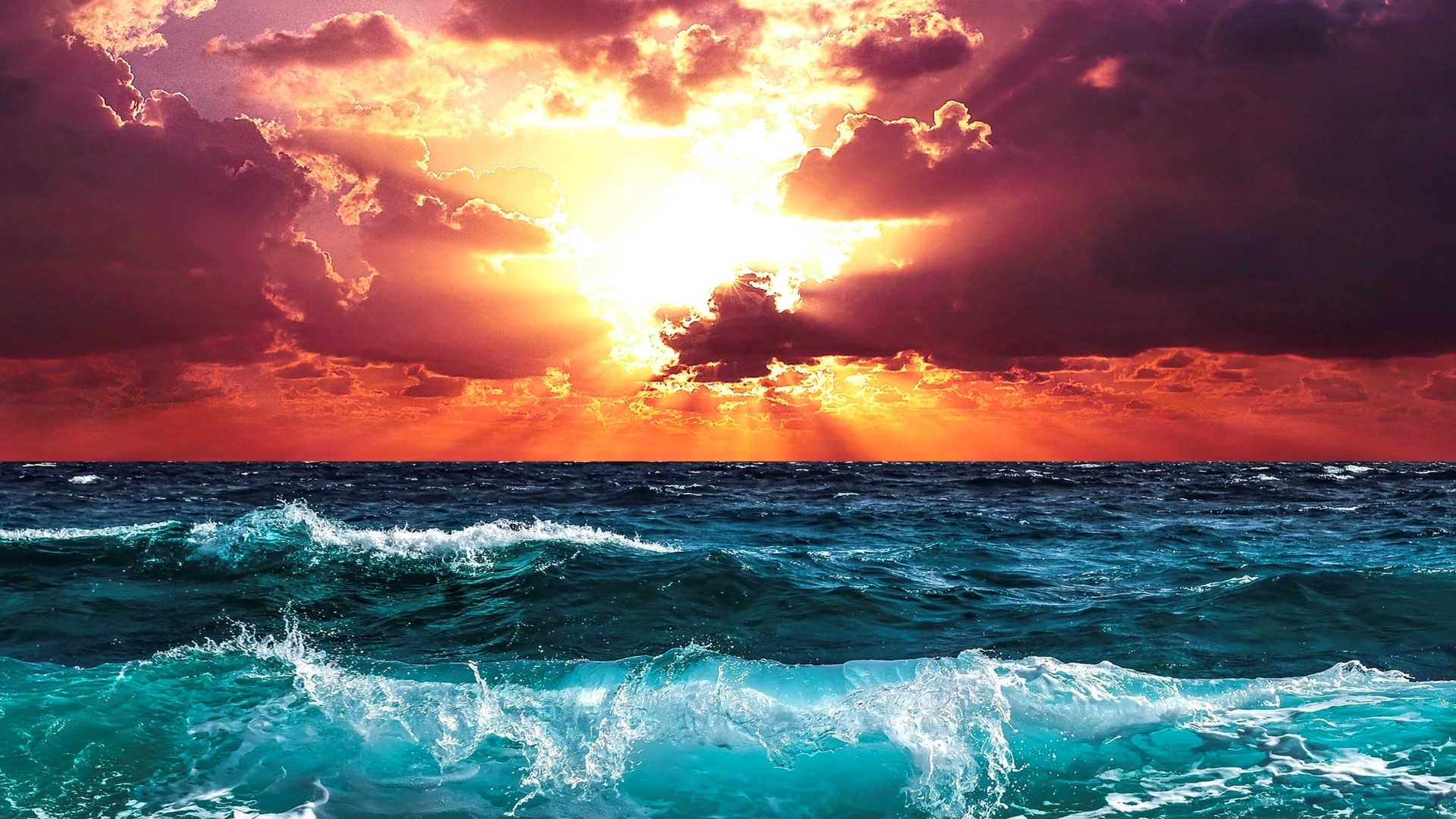 Dramatic Sunset Over Ocean Waves HD Wallpaper