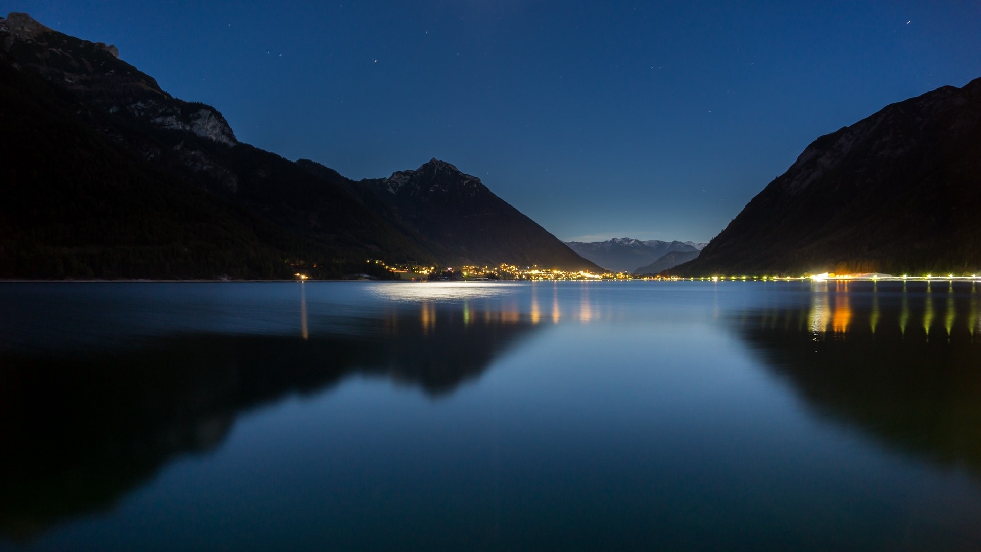 Lake and Mountains at Night with Town Lights HD Wallpaper
