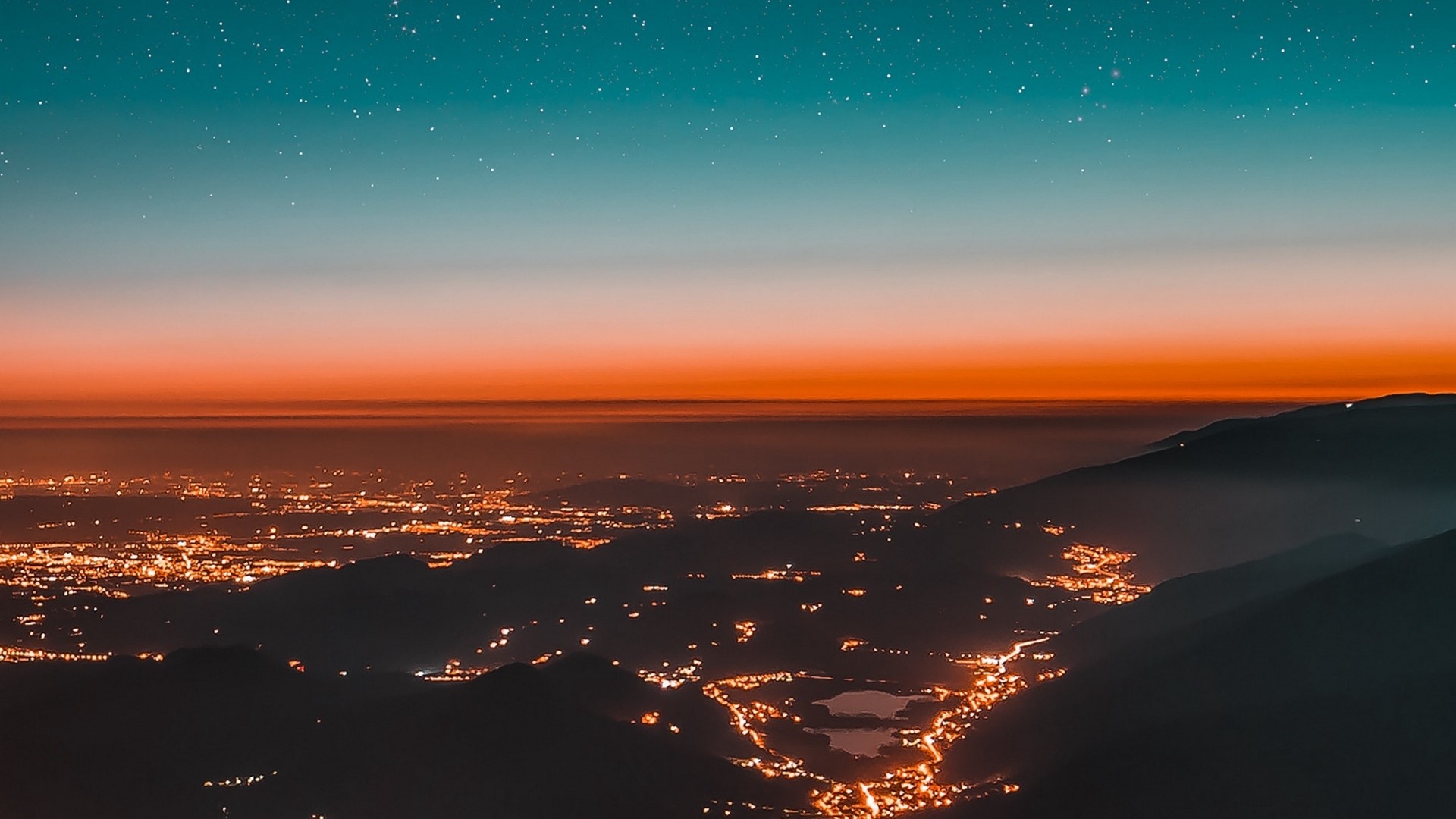 City lights at dusk with starry sky HD Wallpaper