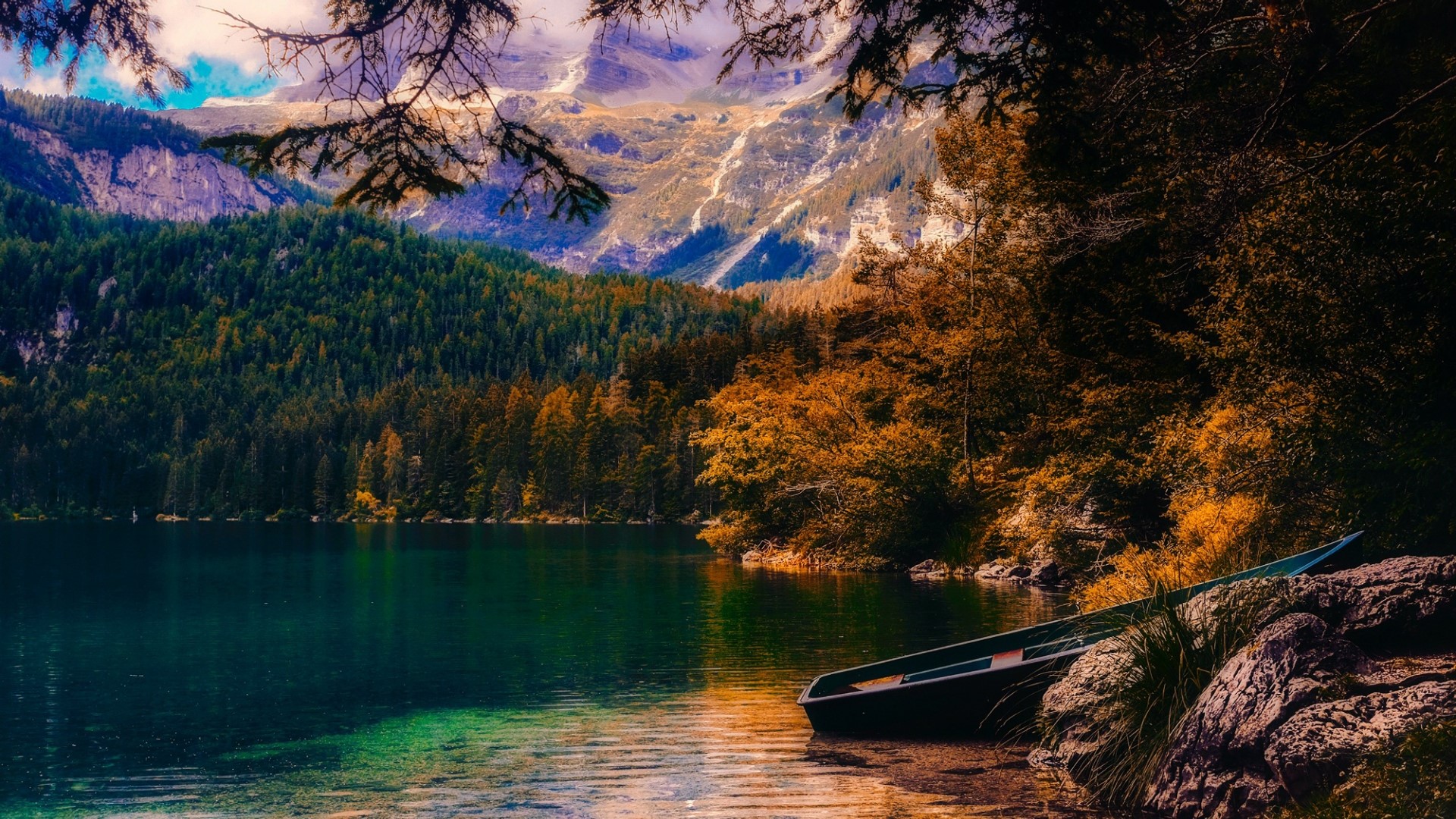 Boat on a lake with mountains and autumn trees HD Wallpaper