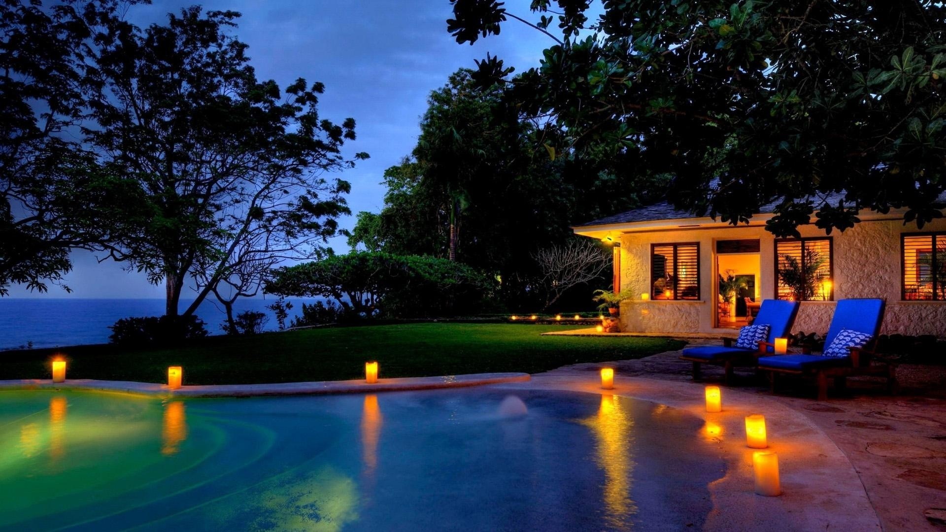 Villa with pool and ocean view at dusk HD Wallpaper