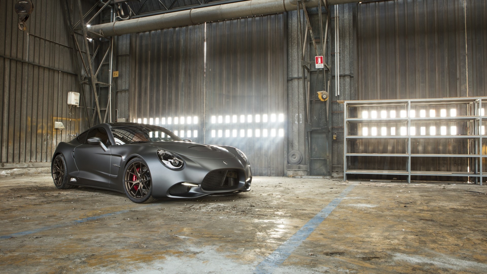 Puritalia Berlinetta sports car in a warehouse HD Wallpaper